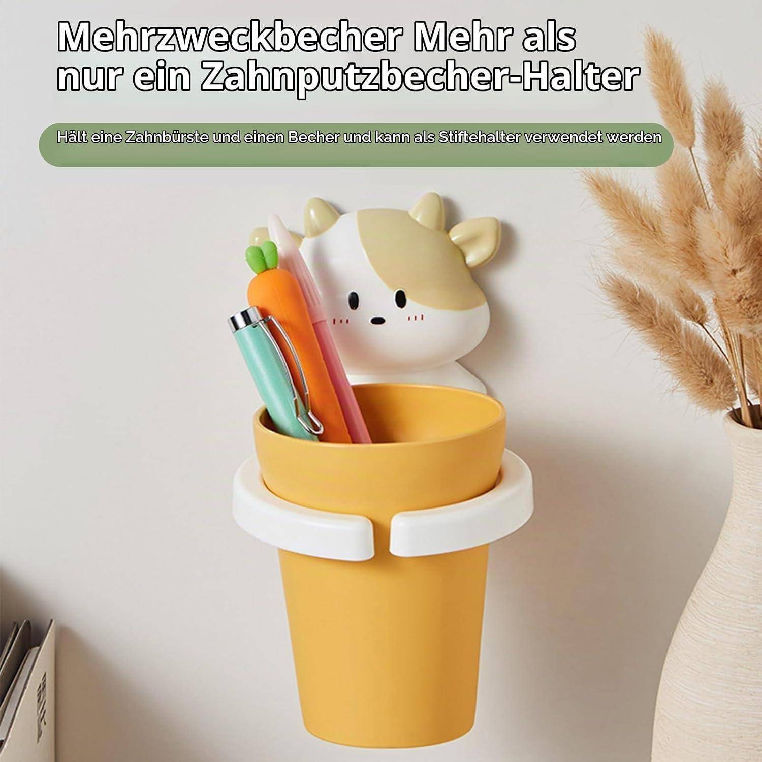 Gelber becherförmiger Behälter mit niedlichem Tiermotiv, der Zahnbürsten und Stifte hält; der Text besagt, dass er auch als Stifthalter verwendet werden kann.
