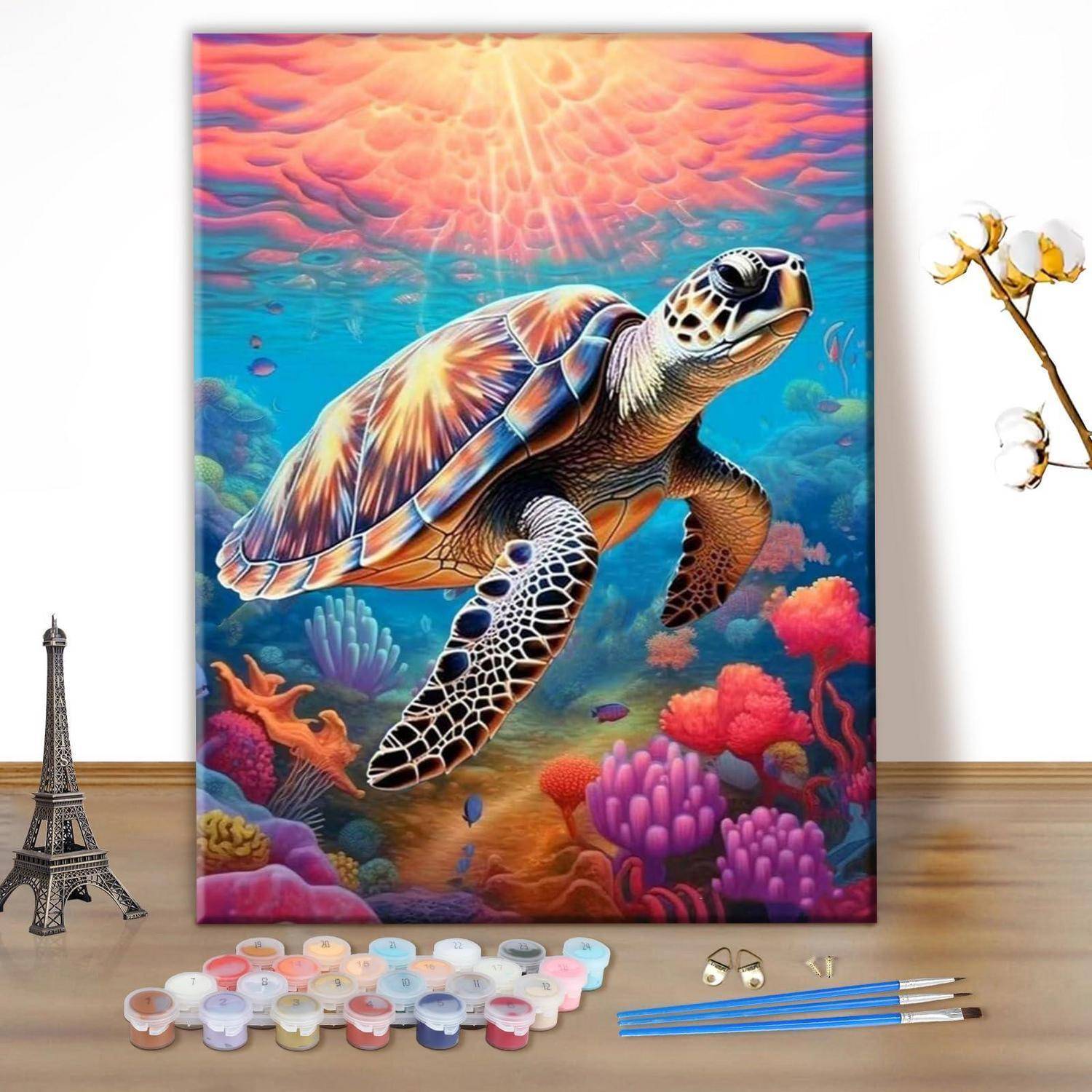 Buntes Leinwandgemälde einer Meeresschildkröte, die über ein lebendiges Korallenriff schwimmt, dargestellt in einem Raum mit Kunstmaterialien in der Nähe.