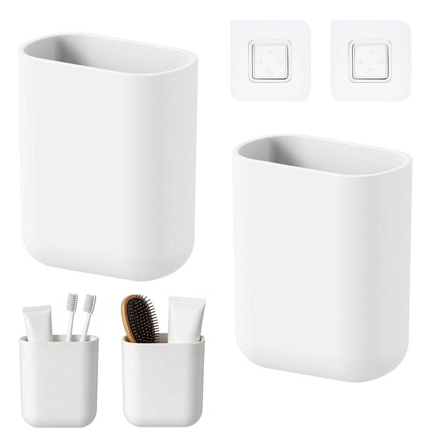 Weiße wandmontierte Organisatortasse in mehreren Ansichten, mit Klebemontierungspads und Beispielen zum Halten von Zahnbürsten und Toilettenartikeln.
