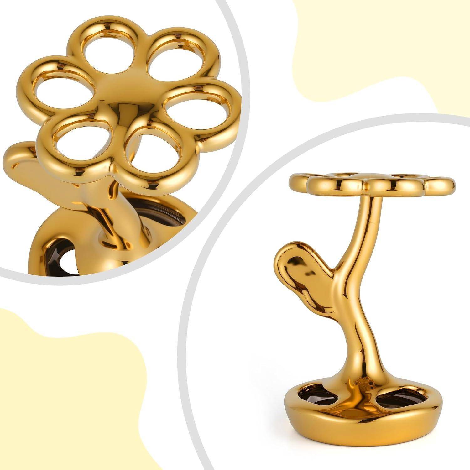Goldener blumenförmiger Ständer mit kreisförmiger Oberplatte und abgerundeter Basis, von vorne und in nahaufnahmiger Detailansicht dargestellt.