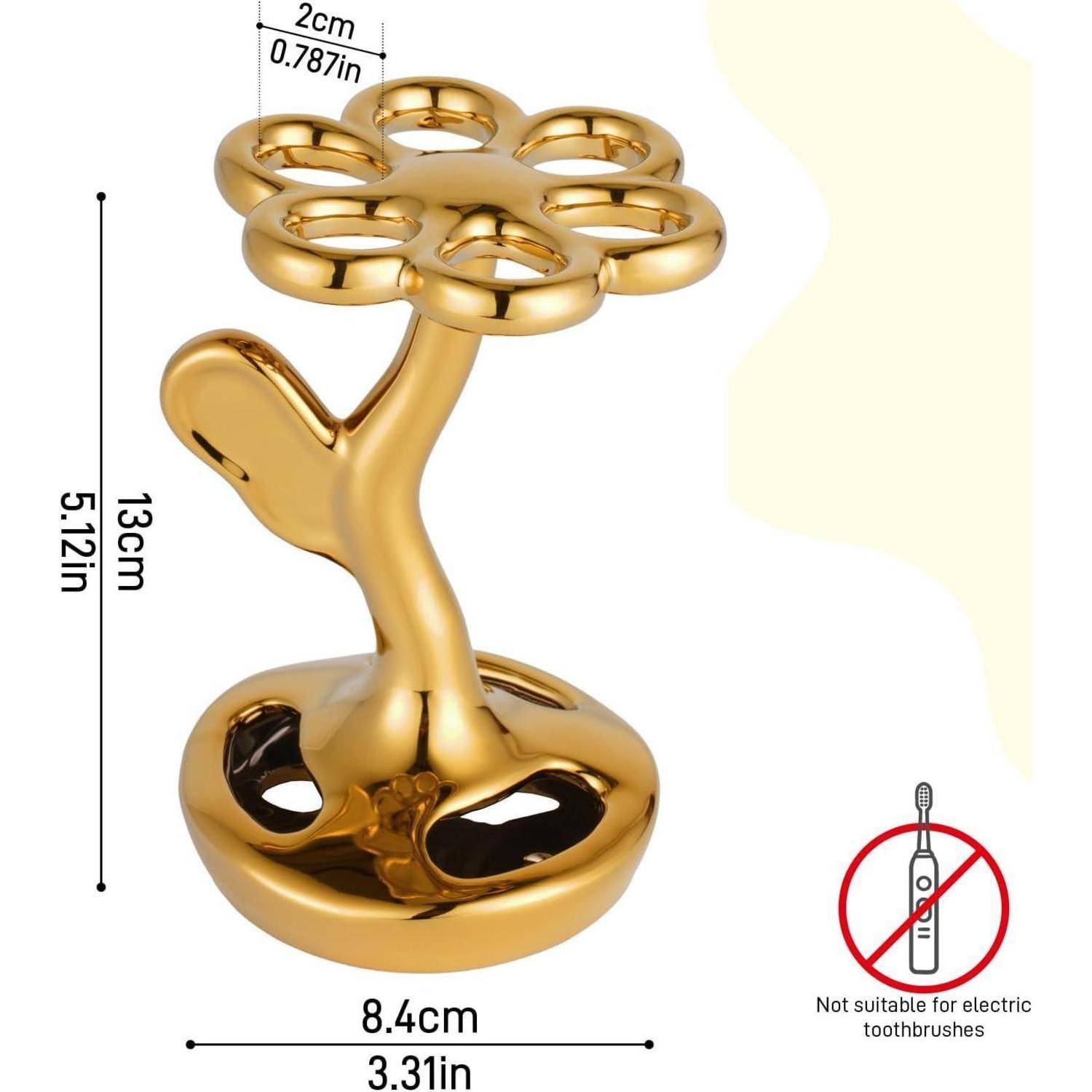 Zahnbürstenhalter in Goldfarbe in Baumform mit sieben kreisförmigen Schlitzen oben; mit den Abmessungen 13 cm hoch, 8,4 cm breit, und nicht für elektrische Zahnbürsten geeignet.