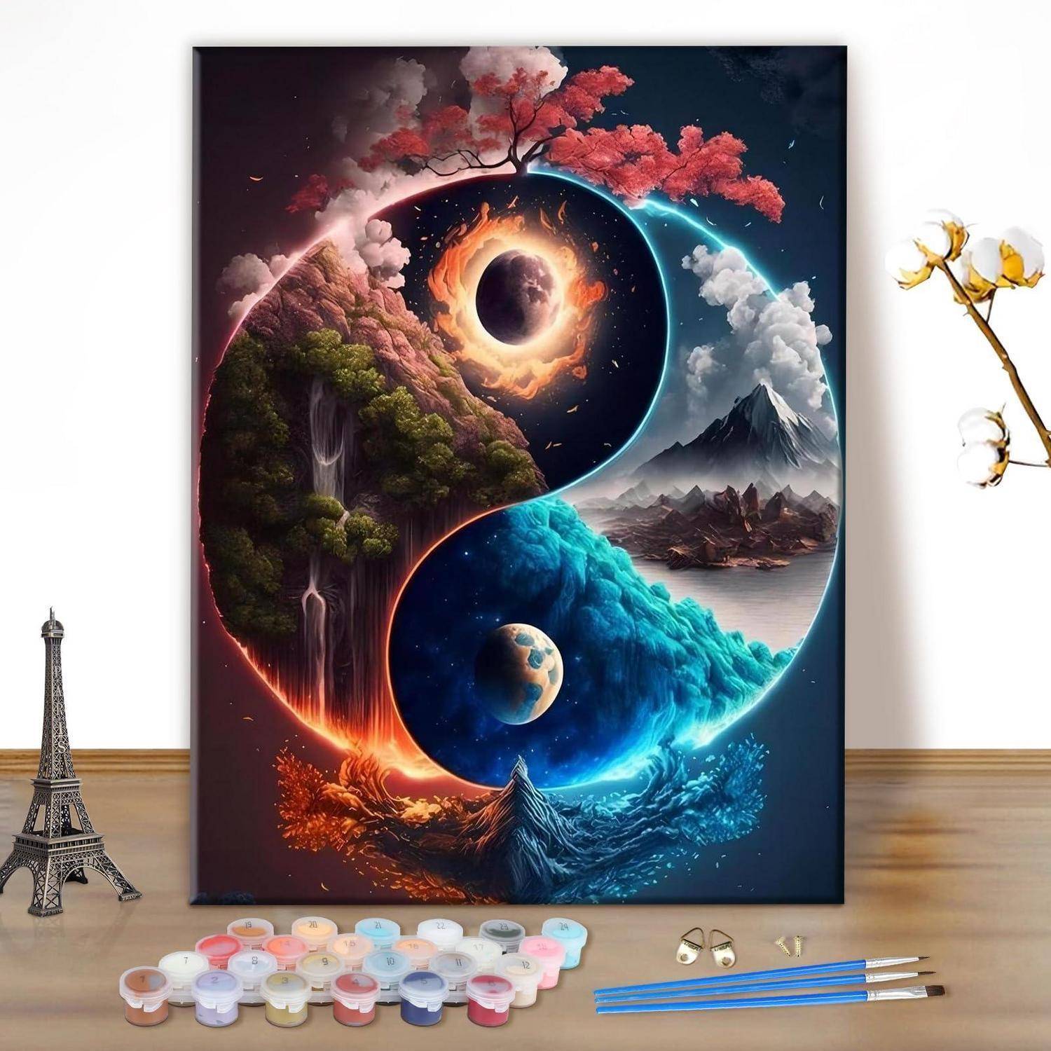 Farbenfrohe Yin-Yang-artige kosmische Landschaftsmalerei mit einer Sonnenfinsternis, Mond, Wasserfällen, Bergen und Planeten, präsentiert mit Kunstbedarf auf einem Tisch.