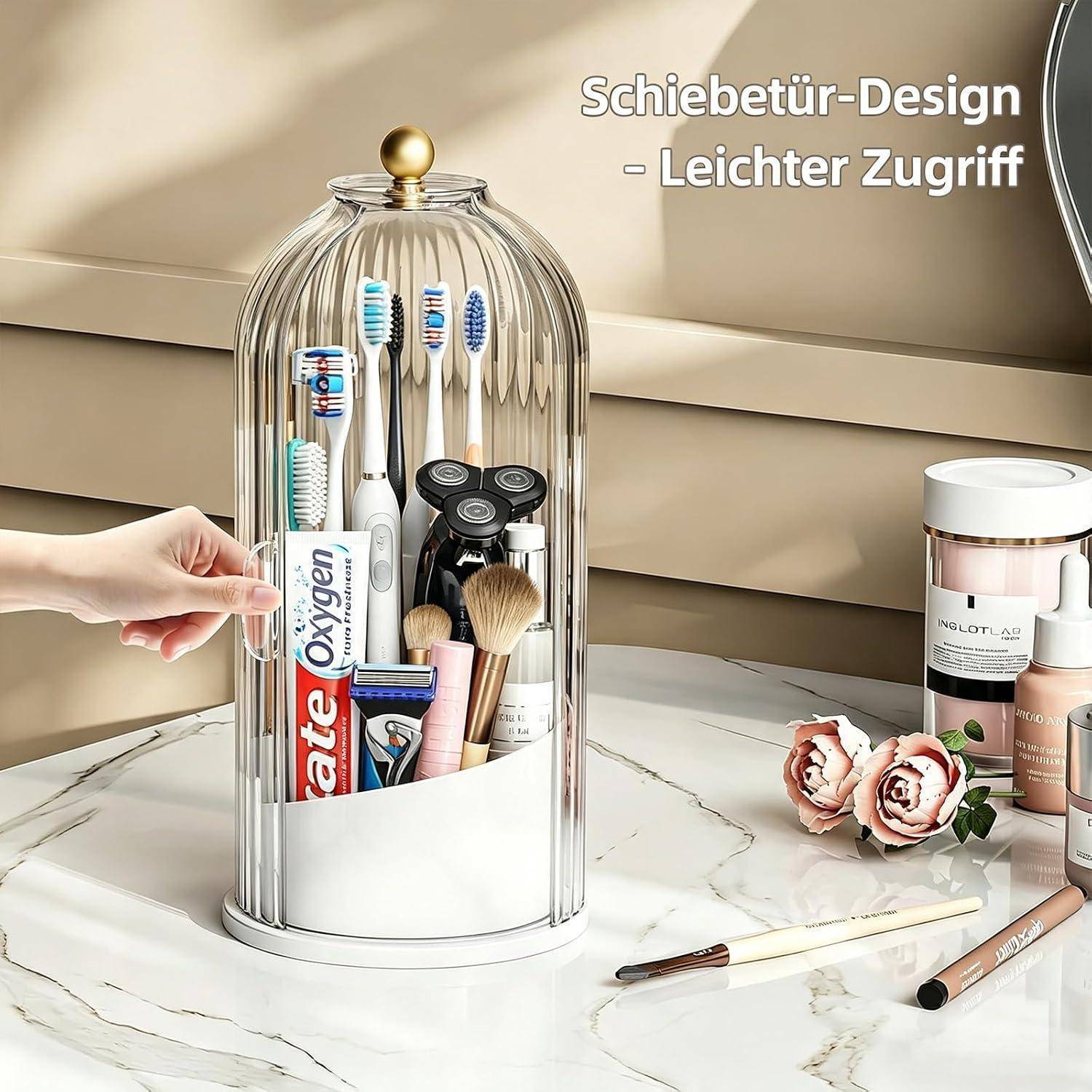 Eine Hand öffnet einen durchsichtigen Badezimmer-Aufbewahrungsorganizer mit Kuppeldach, der Zahnbürsten, Zahnpasta, Rasierer und Make-up-Werkzeuge enthält; der Text lautet „Schiebetür-Design - Leichter Zugriff
