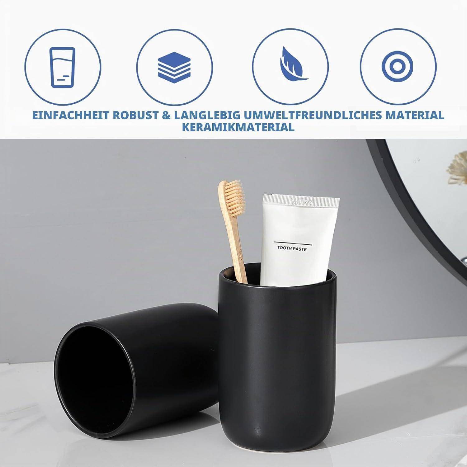 Schwarze Keramik-Badezimmertasse mit einer Zahnbürste und Zahnpasta, wobei eine weitere passende Tasse auf der Seite liegt; Symbole betonen die Langlebigkeit und das umweltfreundliche Keramikmaterial.