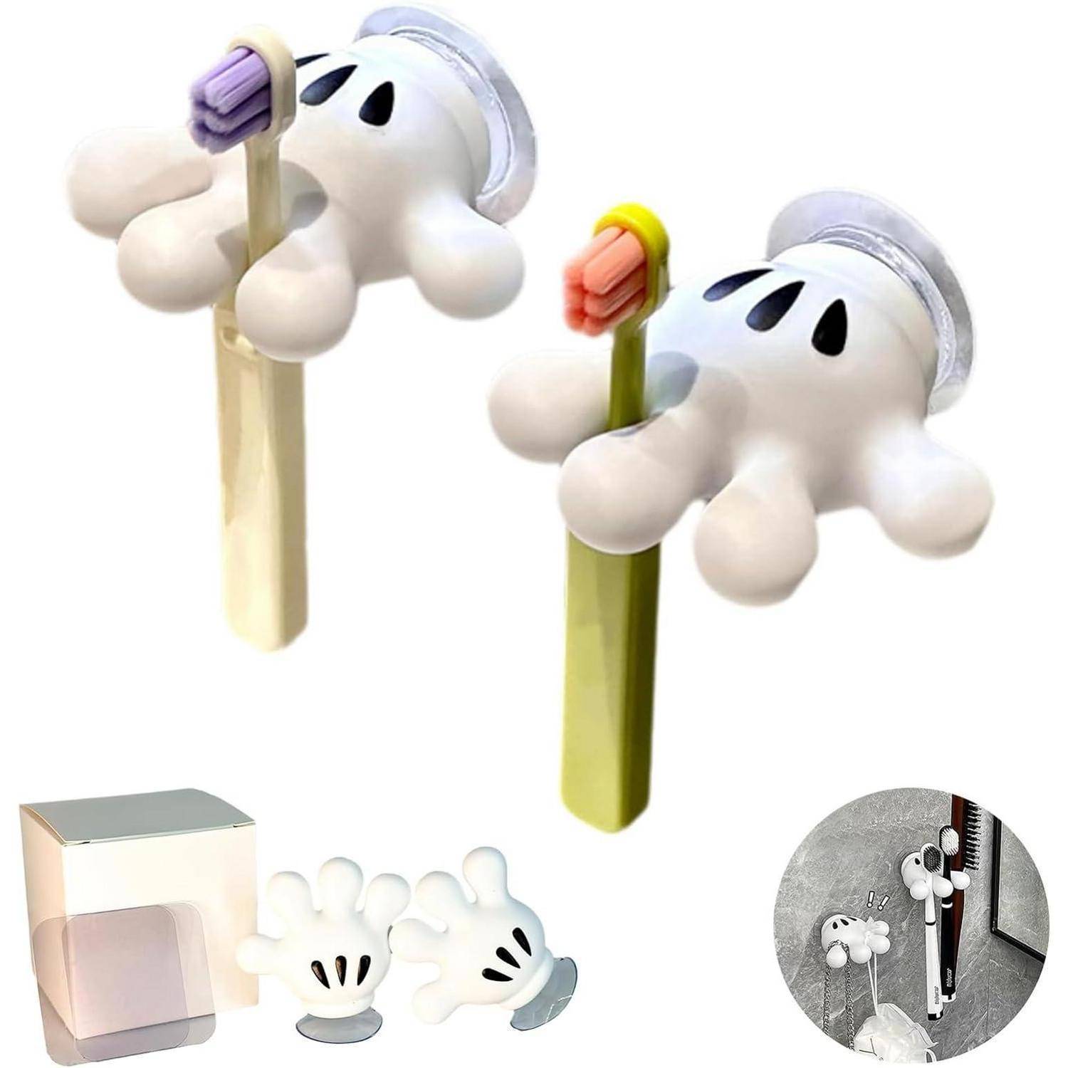 Zahnbürstenhalter in Gespensterform mit Clips in Weiß und Grün, plus ein kleiner quadratischer Aufbewahrungsbehälter und ein Beispiel für die Wandmontage.