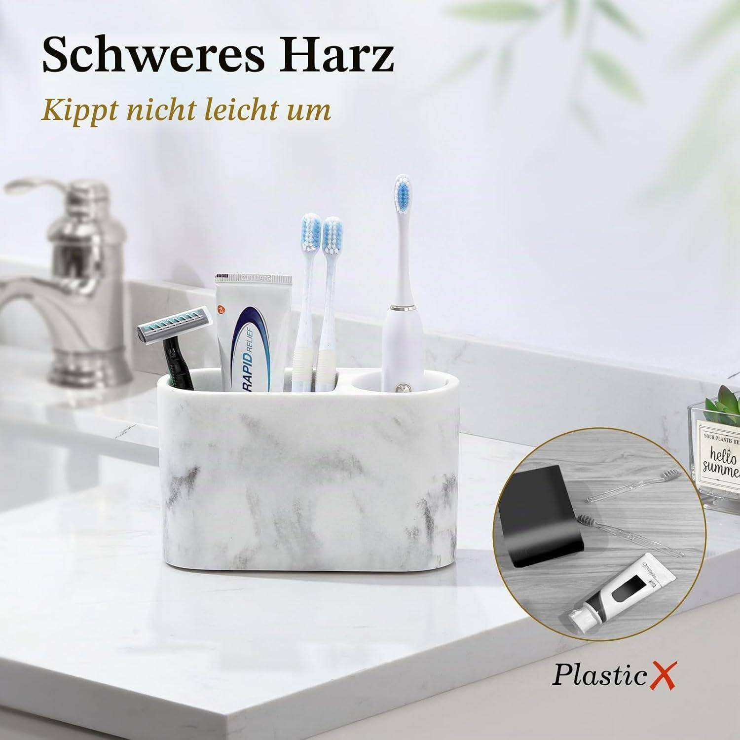 # Anzeige zeigt einen Badezimmerbecher mit Marmor-Optik, der Zahnbürsten und Zahnpasta hält, mit dem Text „Schweres Harz