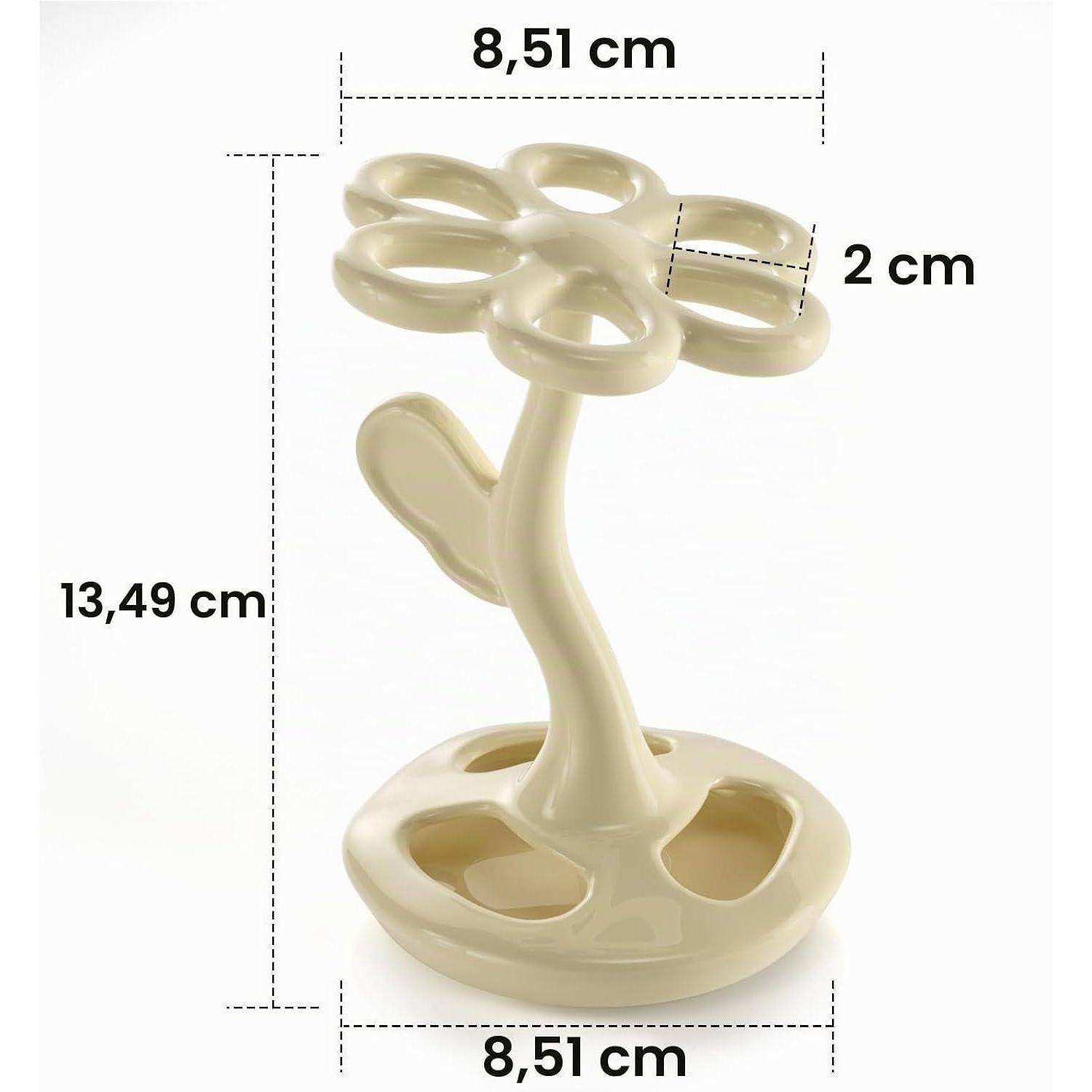 Beige blumenförmiger Ständer mit Maßangaben: 13,49 cm hoch, 8,51 cm breit und 2 cm dick.