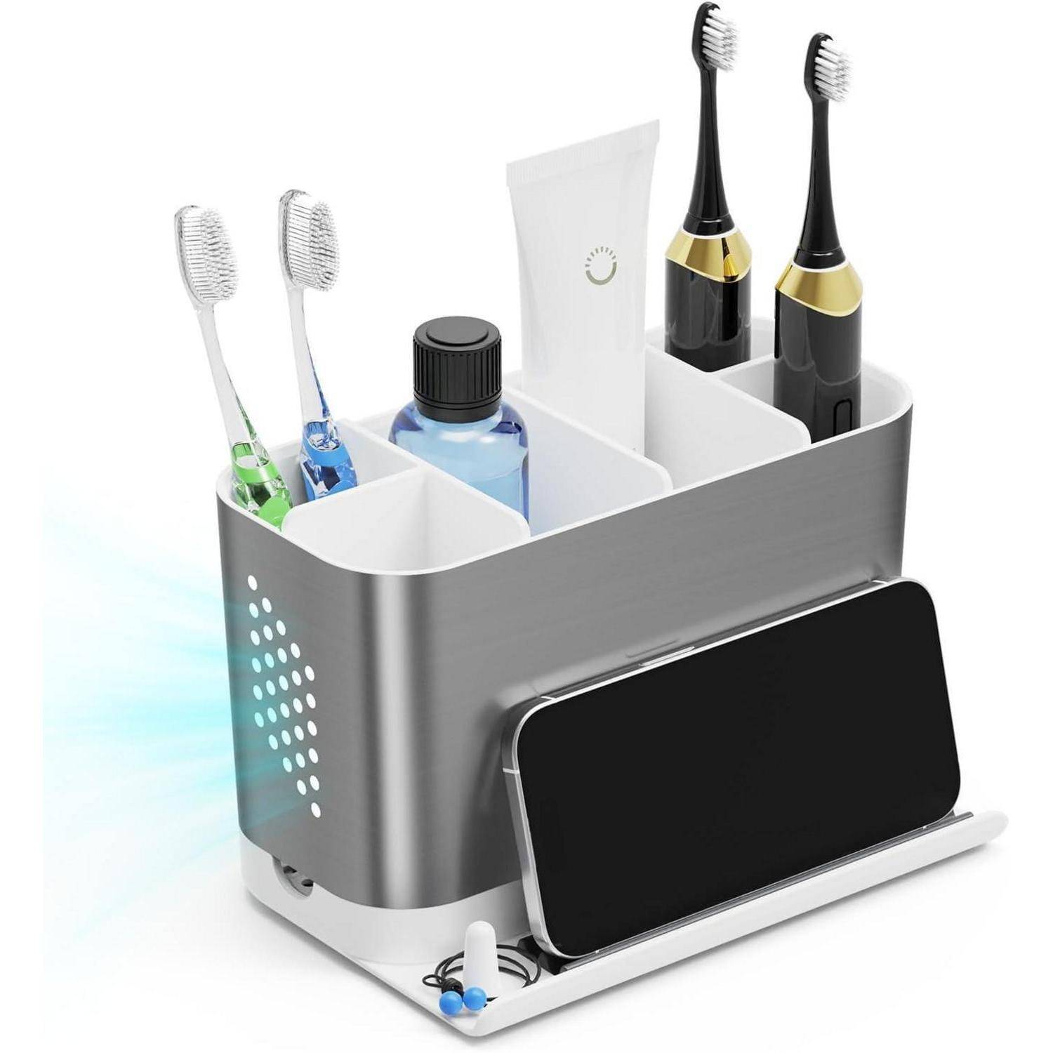Badezimmer-Arbeitsplatte-Organizer, der zwei elektrische Zahnbürsten, zwei manuelle Zahnbürsten, Zahnpasta und ein Smartphone auf einer Ladestation hält.