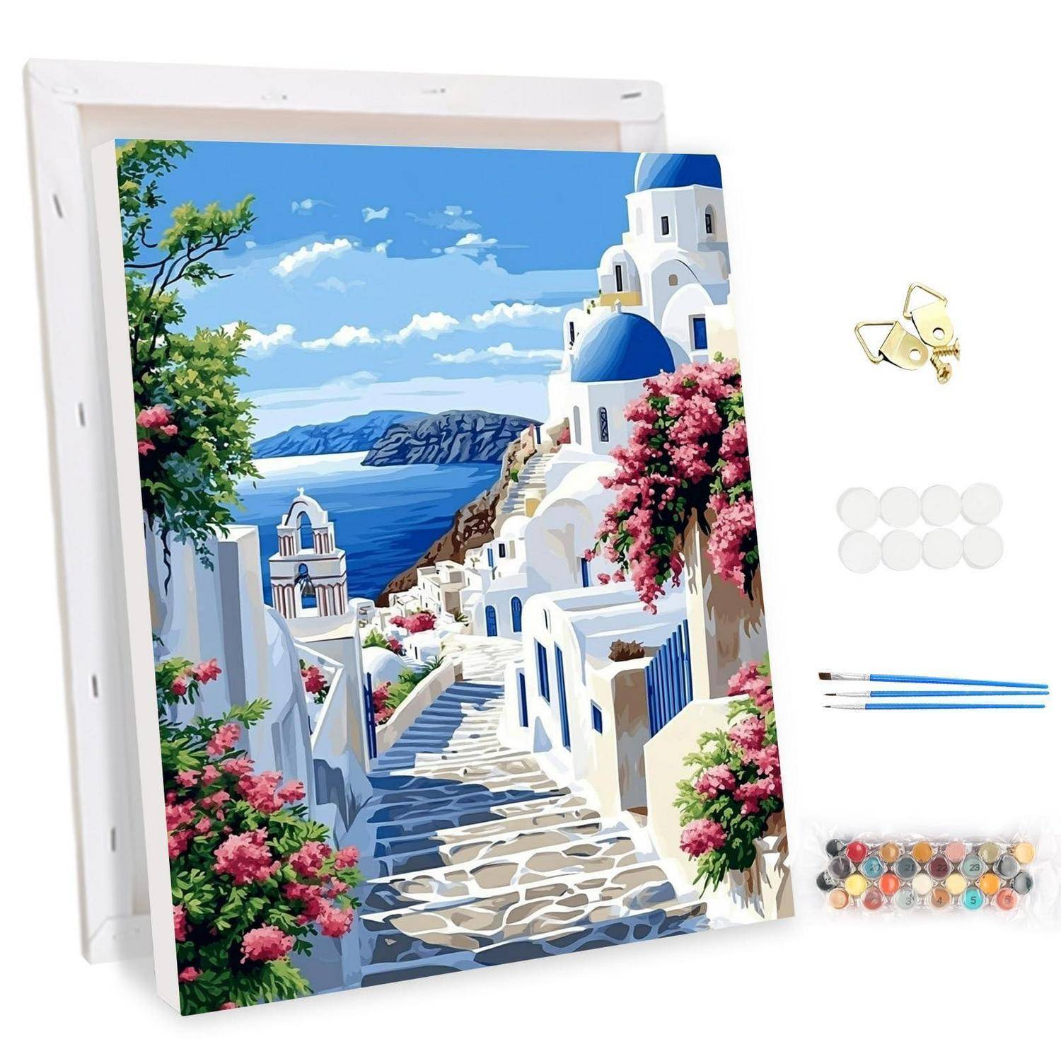 DIY-Diamantmalerei-Set mit einer Küstenszene eines griechischen Dorfes mit weißen Gebäuden, blauen Kuppeln und Meerblick, plus Werkzeugen und Perlen.