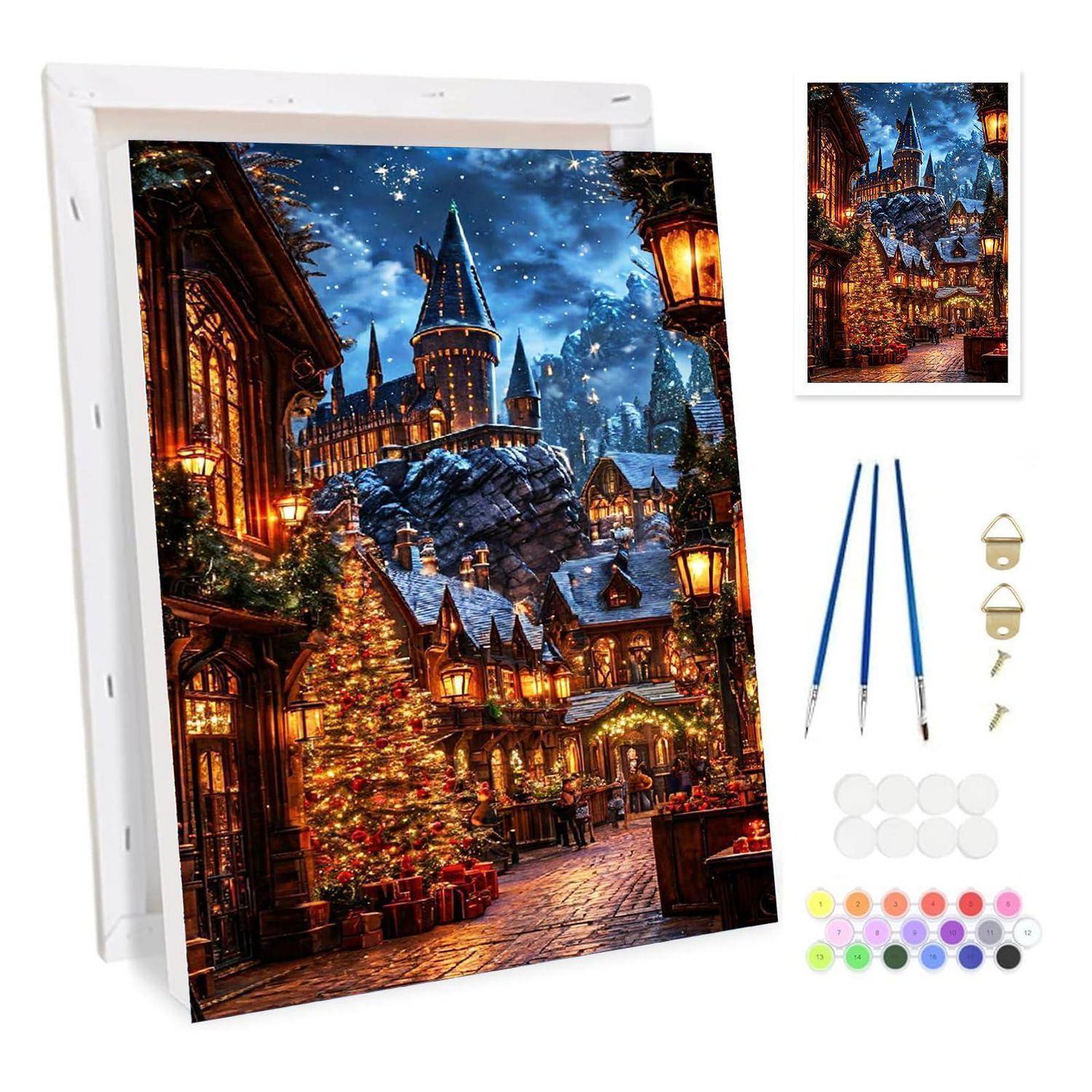 Diamantmalerei-Set mit einer Winterdorf-Szene auf einer Leinwand, dargestellt mit Werkzeugen, Bohrschalen und farbigen Perlen.