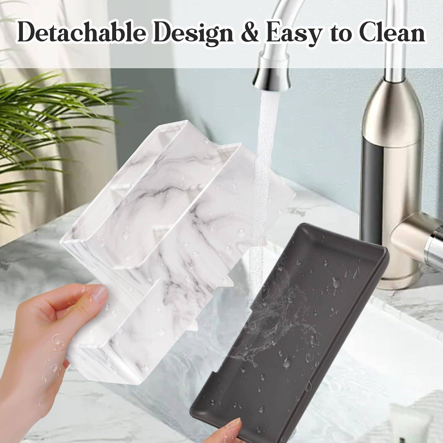 Hand hält abnehmbaren, marmorgemusterten Waschbecken-Seifenhalter unter fließendes Wasser, zeigt einfaches Reinigungsdesign; Text lautet „Abnehmbares Design & Einfach zu reinigen