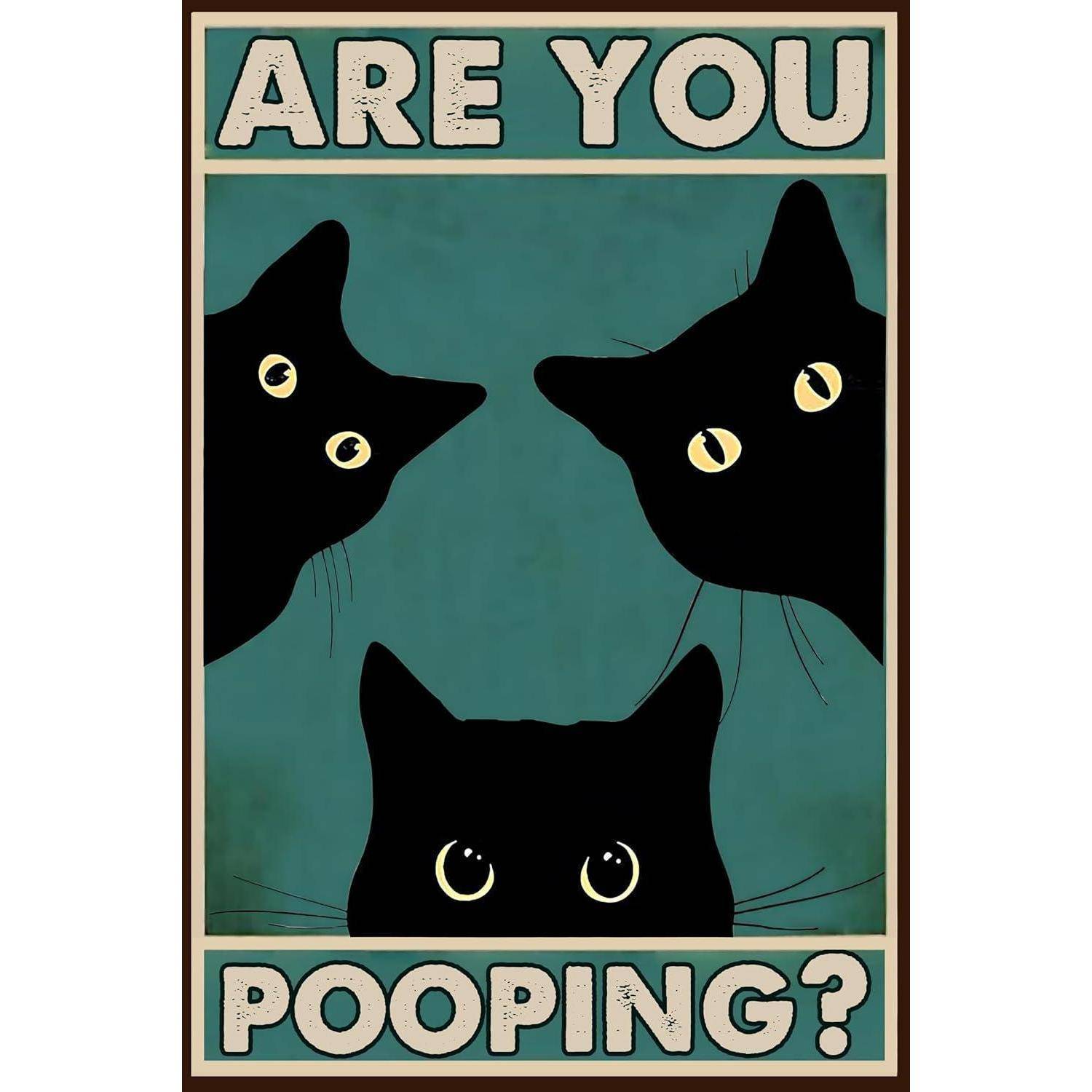 Plakat mit drei schwarzen Katzengesichtern um den Text „MACHST DU GERADE KACKA?