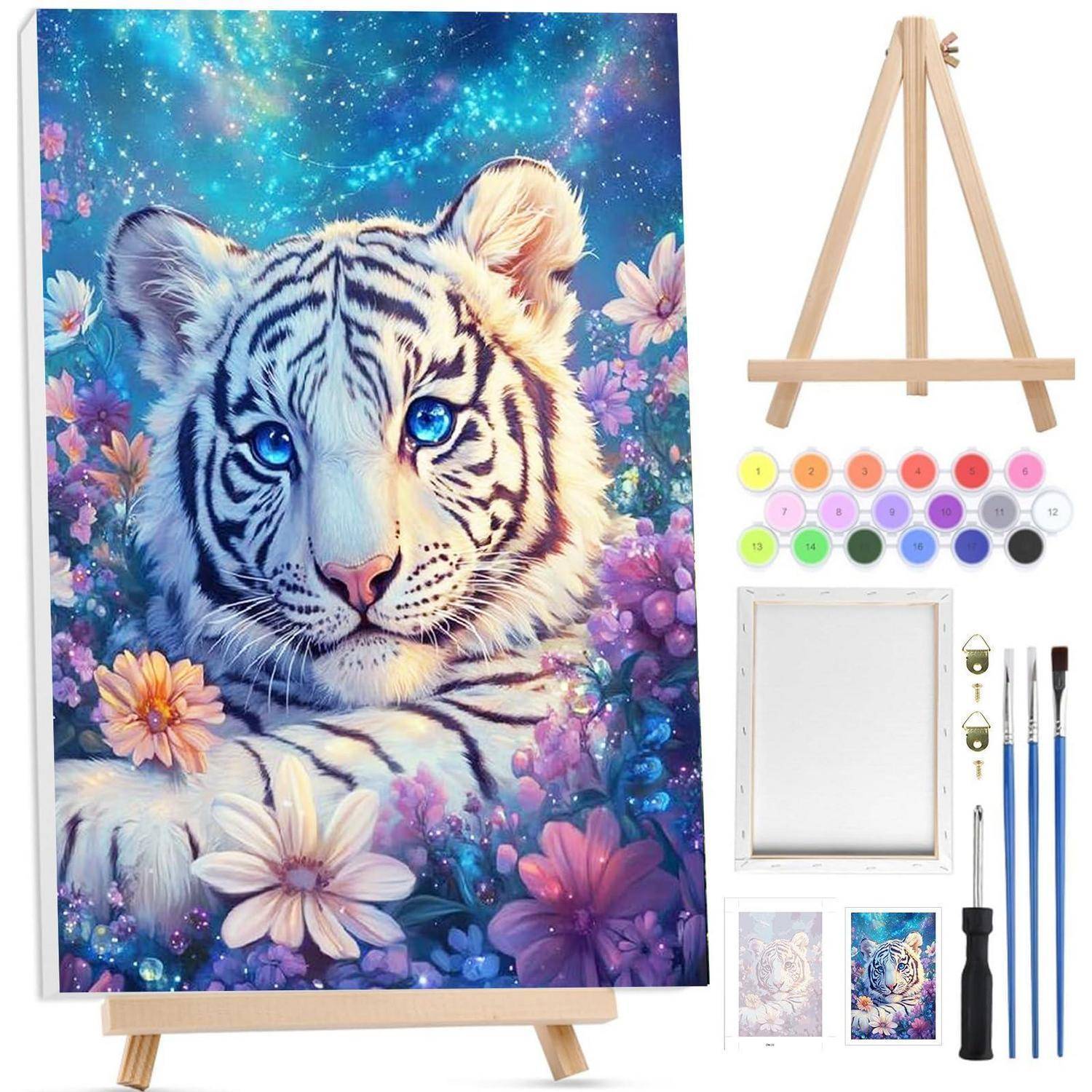 Kunstset mit einer Tigermalerei auf einer Staffelei neben Materialien: Farbpalette, leere Leinwand, kleine Drucke und Pinsel.