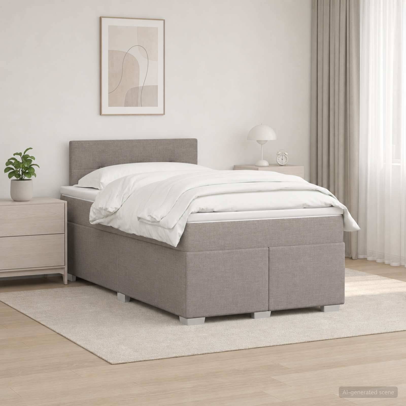 Ein modernes, ordentlich gemachtes Bett mit grauem gepolstertem Rahmen steht in einem hellen, minimalistischen Schlafzimmer neben einem Nachttisch, einer Pflanze, einer Lampe und Wandkunst.