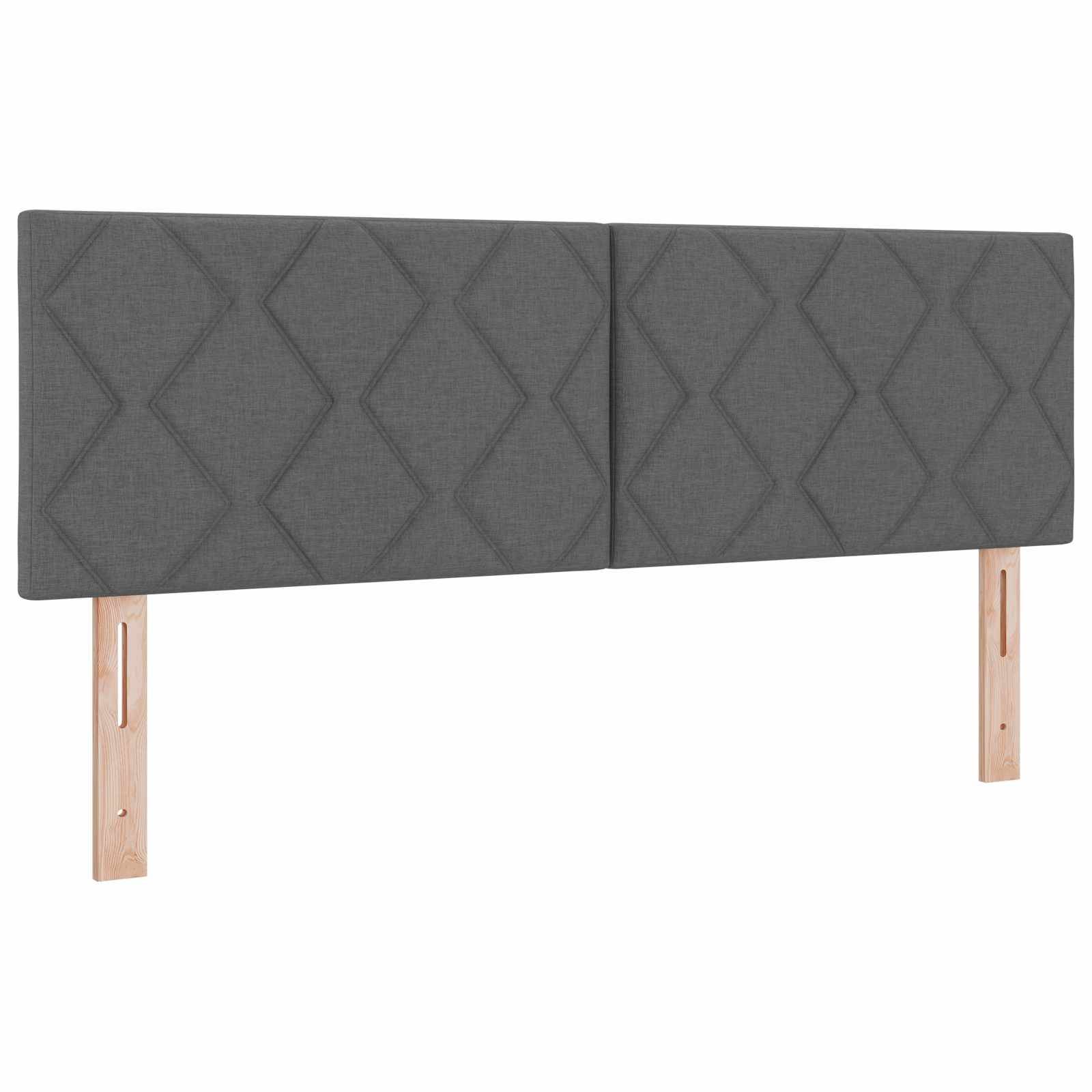 Grauer gepolsterter Kopfteil mit Rautenmuster und zwei hellhölzernen Beinen, auf weißem Hintergrund dargestellt.