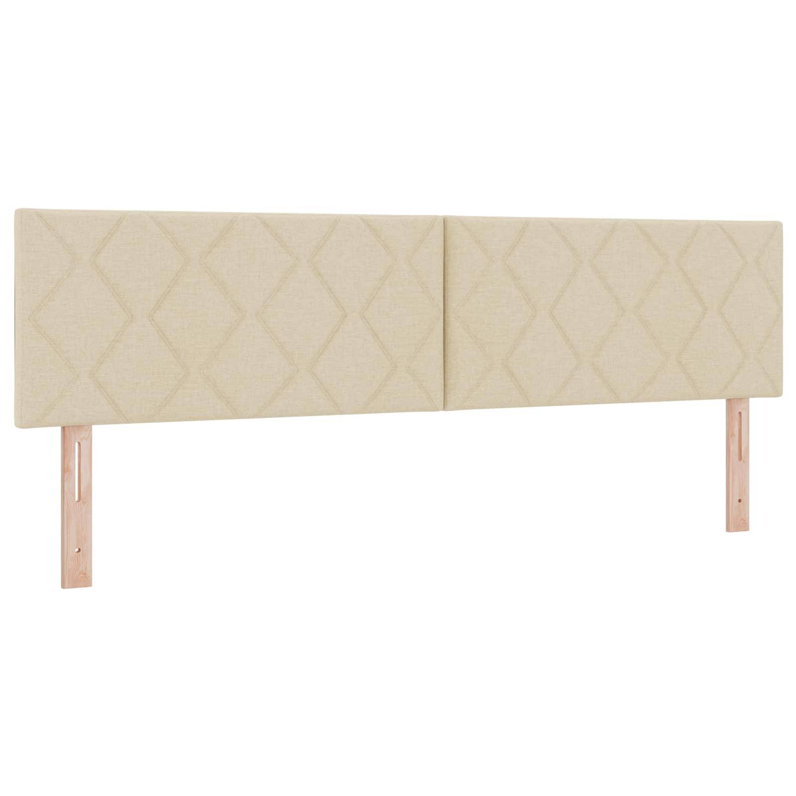 Beige gepolstertes Bettkopfteil mit Rautenmuster und zwei Holzbeinen, vor weißem Hintergrund gezeigt.