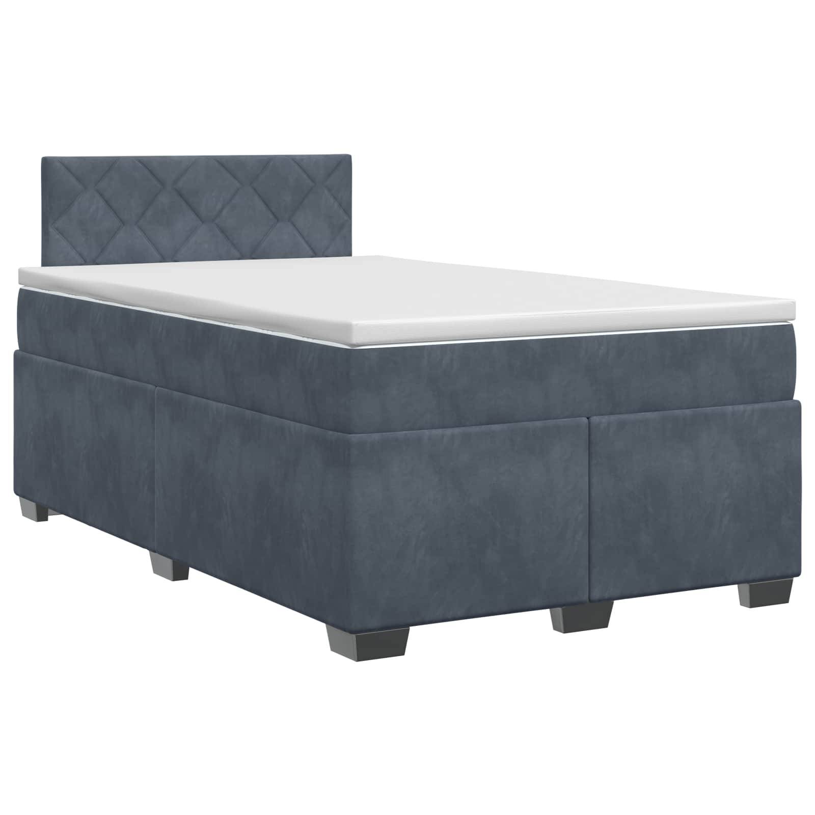 Einfaches, blau gepolstertes Bett mit weißer Matratze und gestepptem Kopfteil, gezeigt auf einfachem weißen Hintergrund.