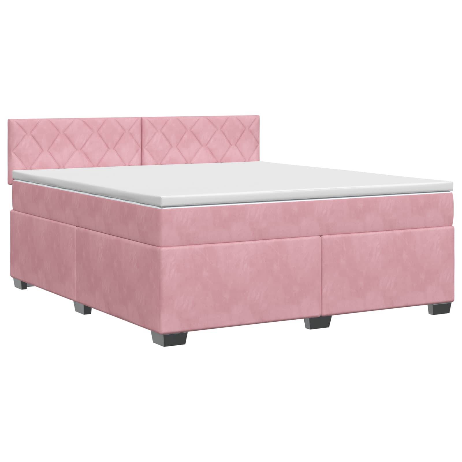Rosa gepolstertes Boxspringbett mit gepolstertem Kopfteil und weiße Matratze auf neutralem Hintergrund.