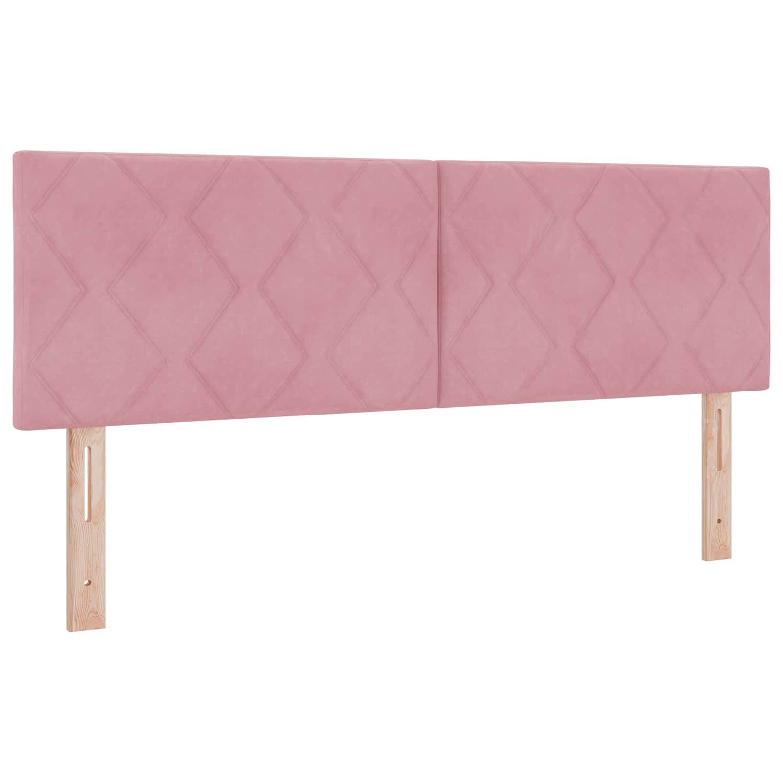 Kopfteils aus rosa Polsterstoff mit gestepptem Rautenmuster und zwei Beinen aus hellem Holz.