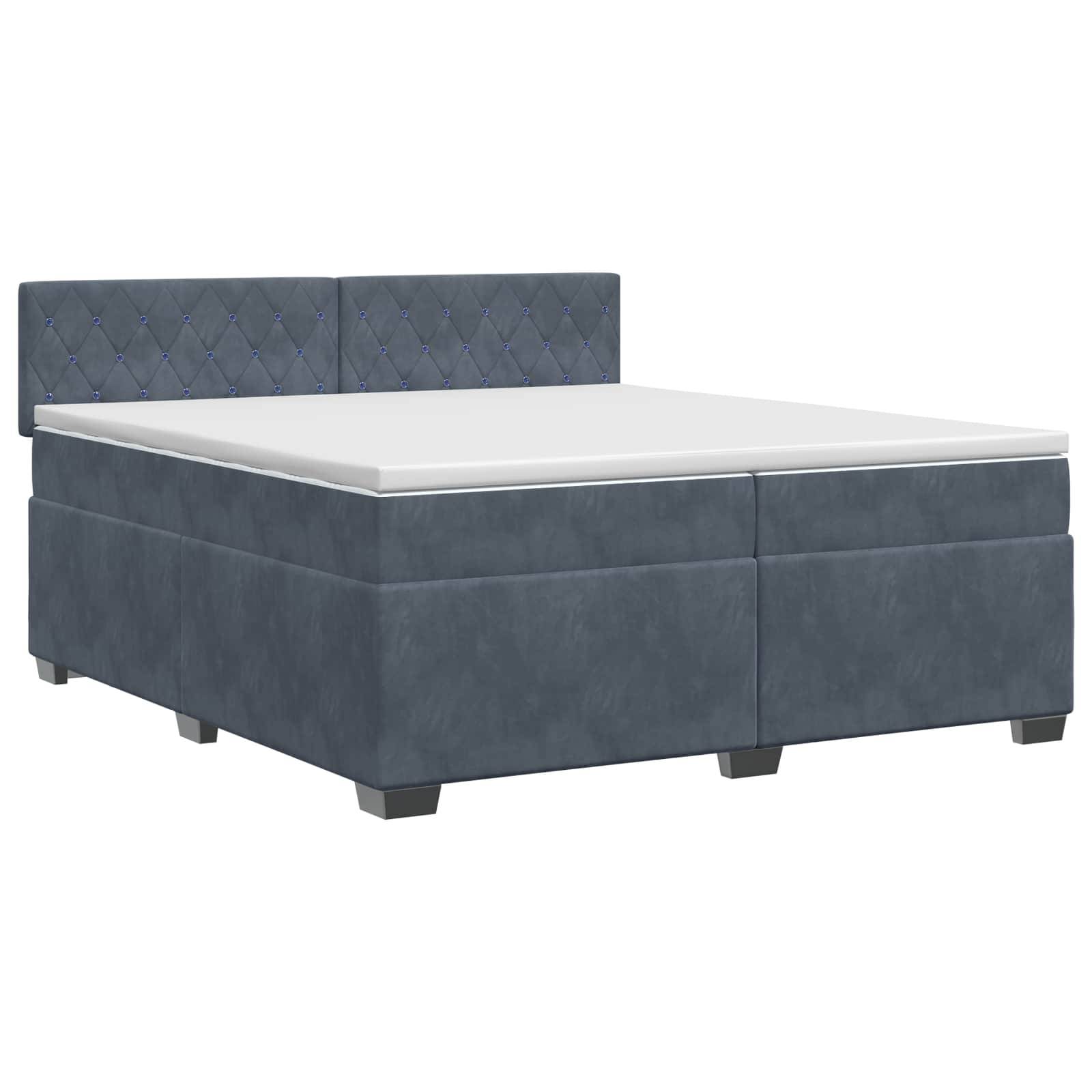 Blau gepolstertes Bett mit gepolstertem Kopfteil und weiße Matratze auf neutralem Hintergrund.