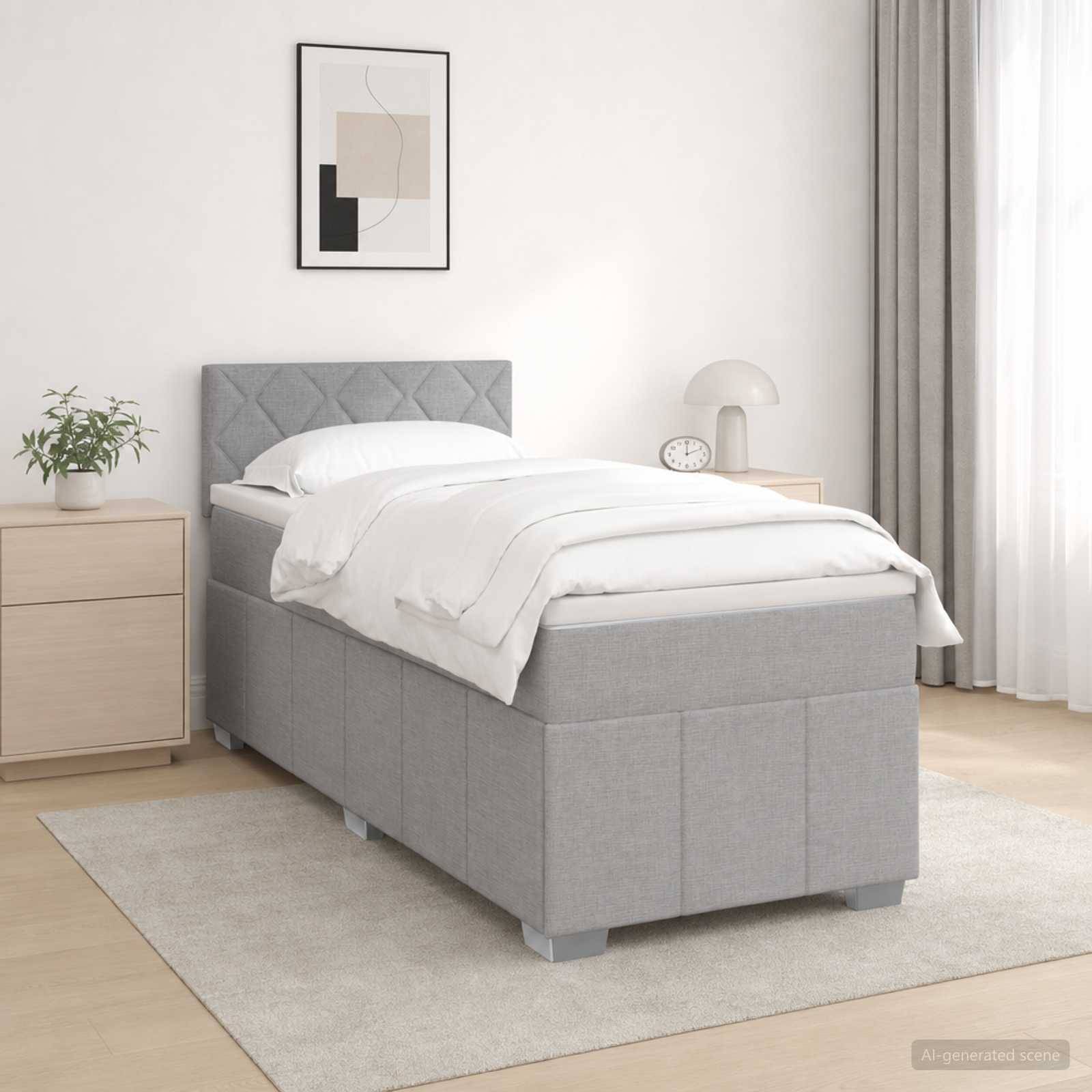 Minimalistisches Schlafzimmer mit einem grau gepolsterten Einzelbett, weißer Bettwäsche, Nachttisch, Lampe, Pflanze und abstracter Wandkunst neben einem Fenster.