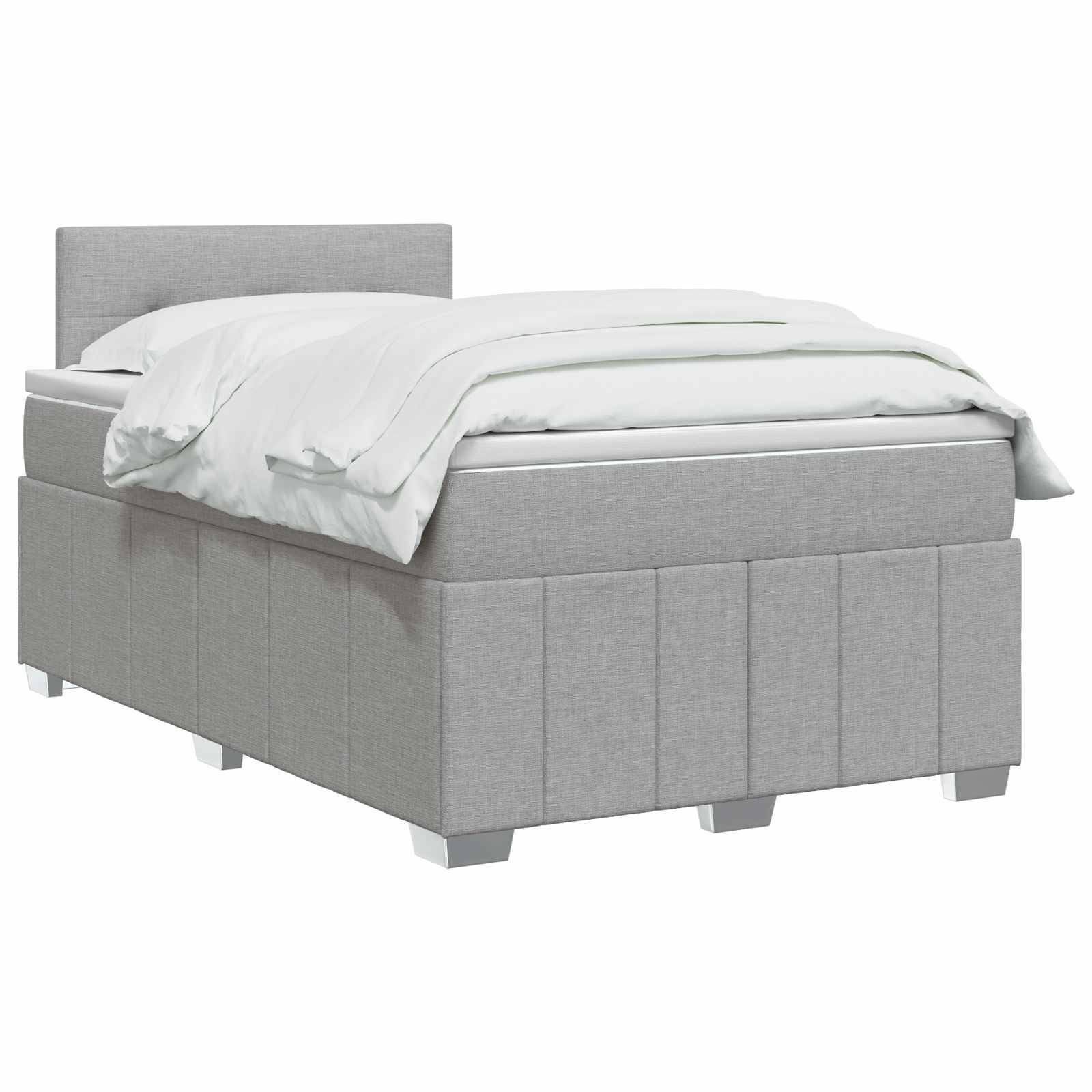 Grau gepolstertes Bett mit Kopfteil, weiße Bettwäsche und niedriges Fußteil auf weißem Hintergrund.