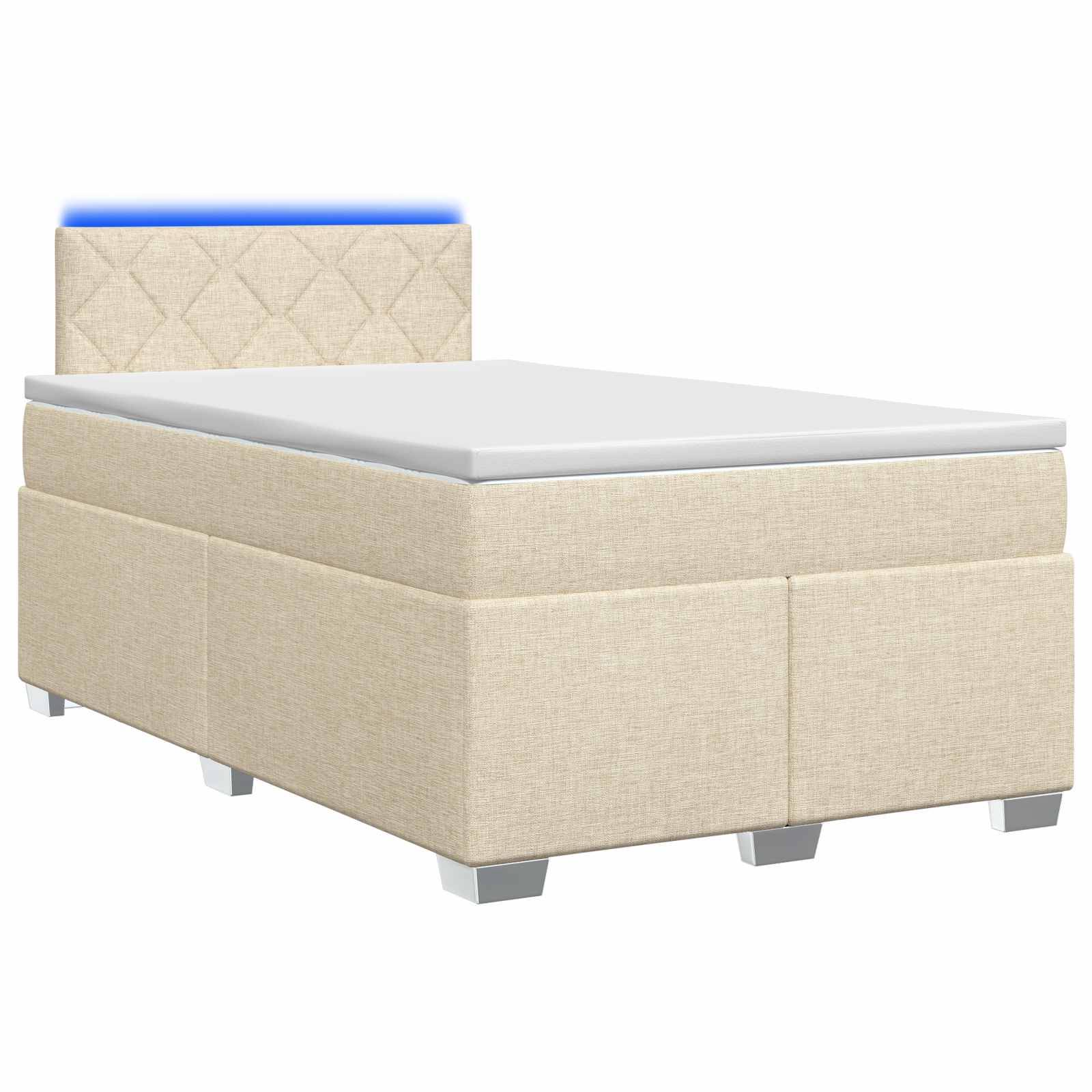 Beiges Einzelbett mit weißer Matratze, niedriger gepolsterter Kopfleiste und silbernen Beinen auf weißem Hintergrund.
