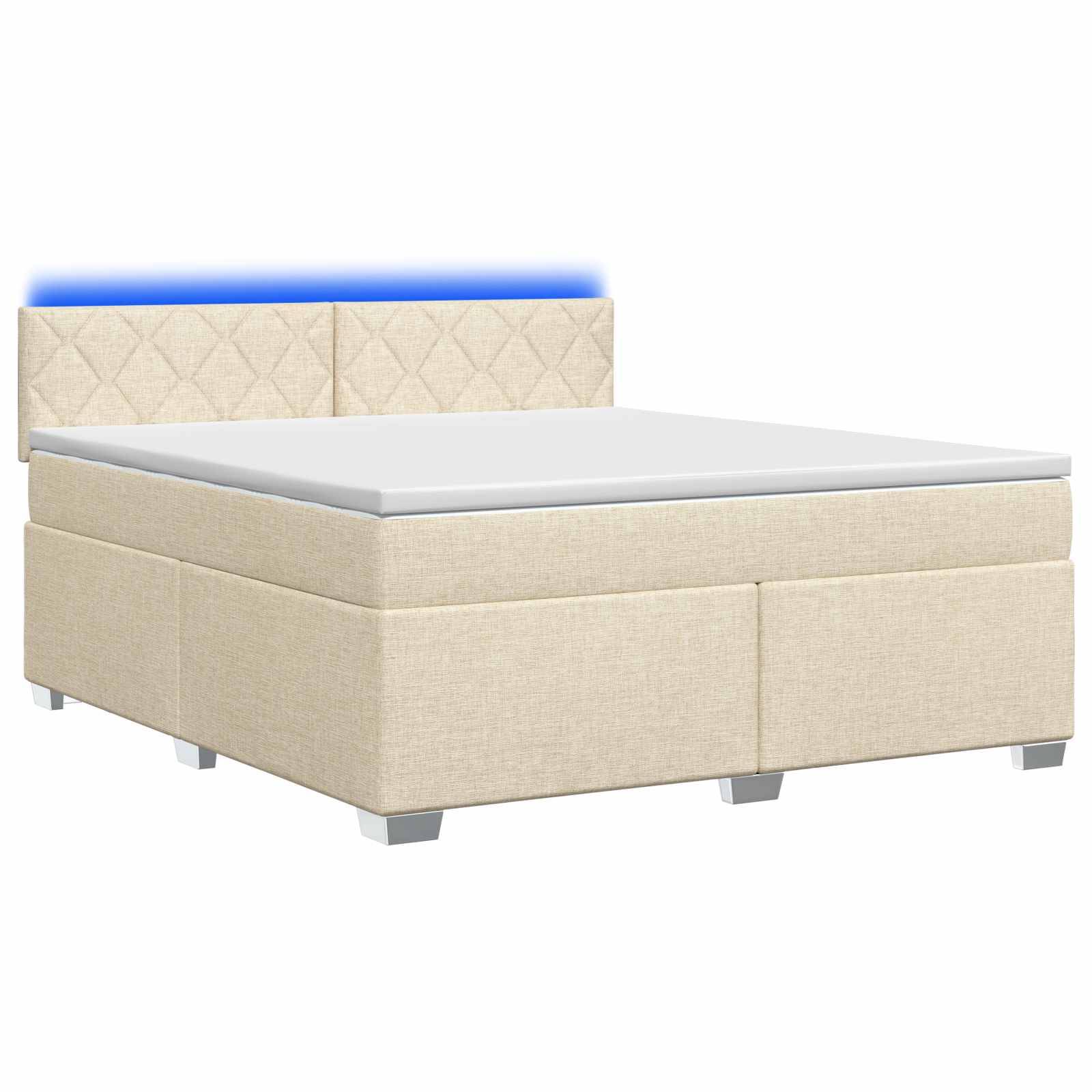 Beige gepolstertes Bett mit gestepptem Kopfteil und weiße Matratze auf weißem Hintergrund.