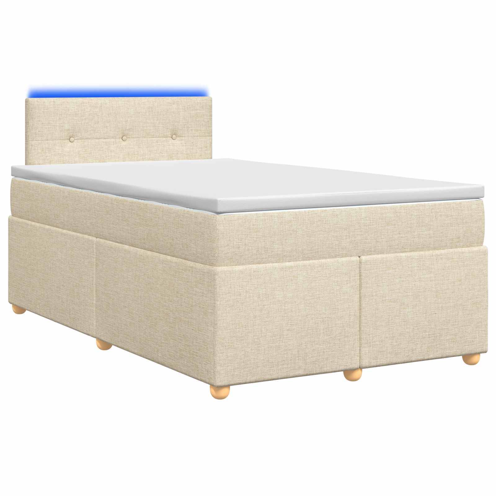 Beige gepolstertes Einzelbett mit gepolstertem Kopfteil und weißer Matratze, in Seitenansicht auf weißem Hintergrund dargestellt.