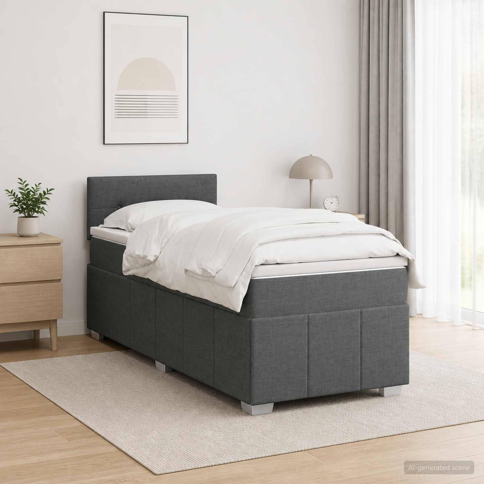 Modernes Schlafzimmer mit einem grauen gepolsterten Einzelbett, weißer Bettwäsche, Nachttisch, Lampe, Pflanze und gerahmter Wandkunst.