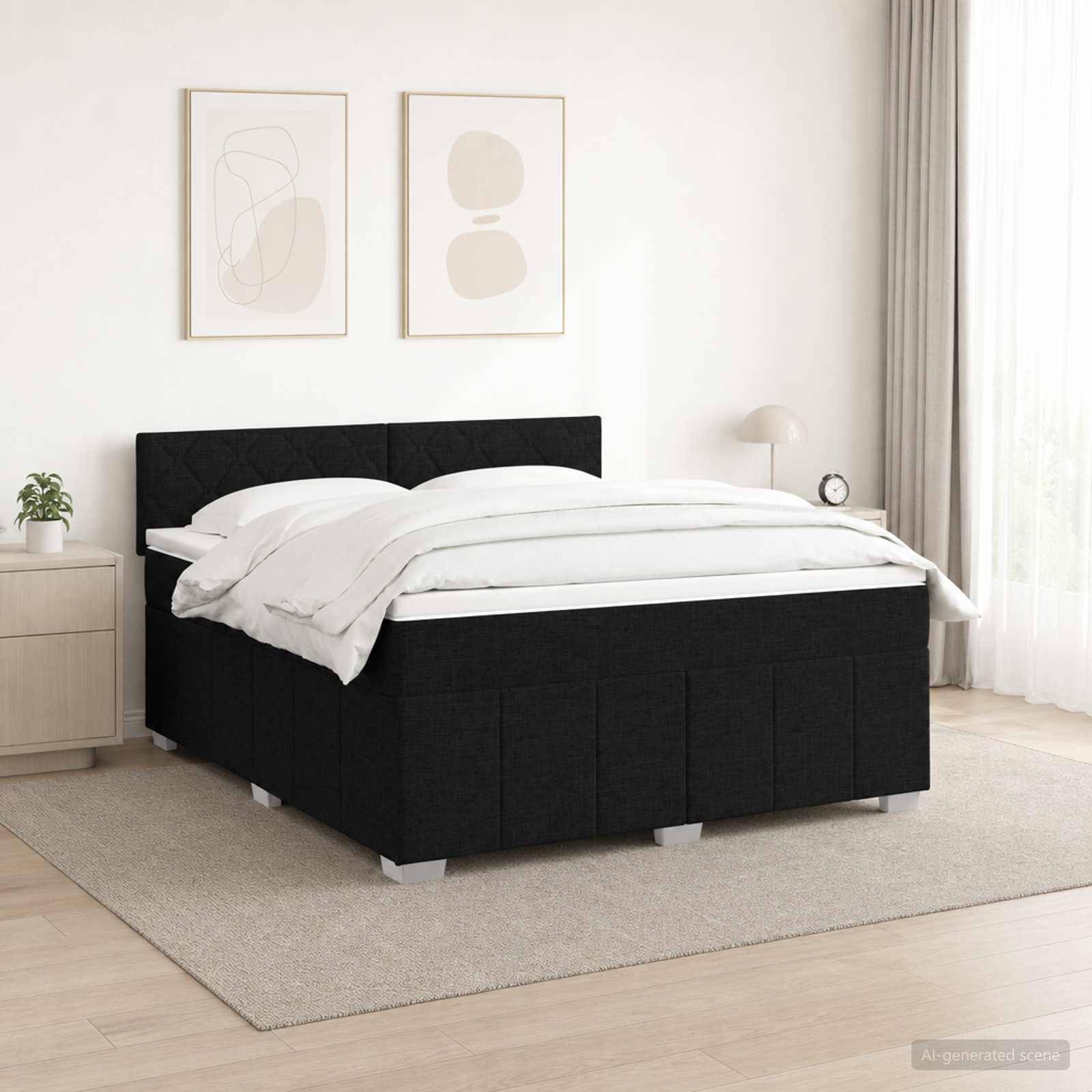 Schwarzes Polsterbett mit weißer Bettwäsche in einem minimalistischen Schlafzimmer, flankiert von einem Nachttisch und einer Lampe unter zwei abstrakten gerahmten Drucken.