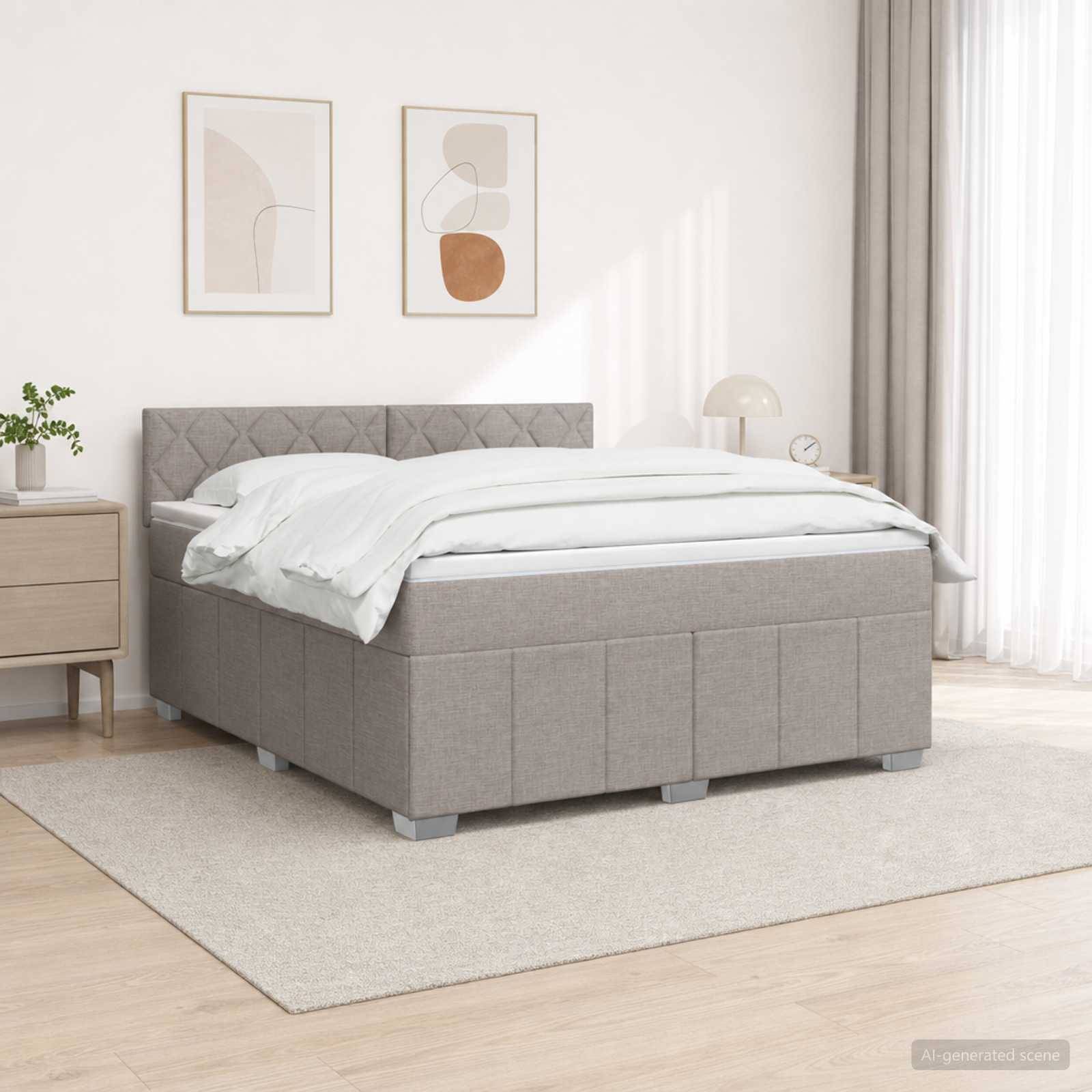 Ein grau gepolstertes Bett mit weißer Bettwäsche in einem hellen minimalistischen Schlafzimmer neben einem Nachttisch und Wandkunst.
