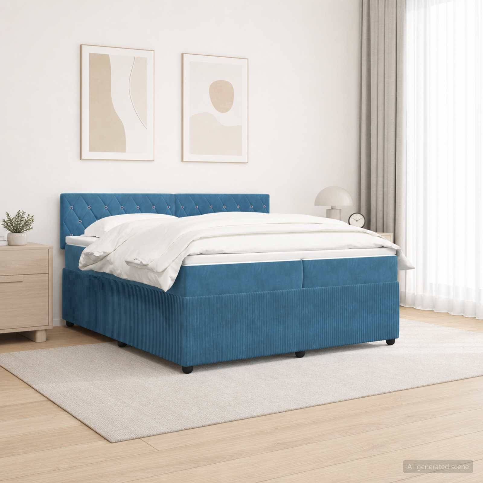 Ein modernes Schlafzimmer mit einem blaugepolsterten Bett, weißer Bettwäsche, zwei abstrakten Wanddrucken, einem Nachttisch und leichten Vorhängen.