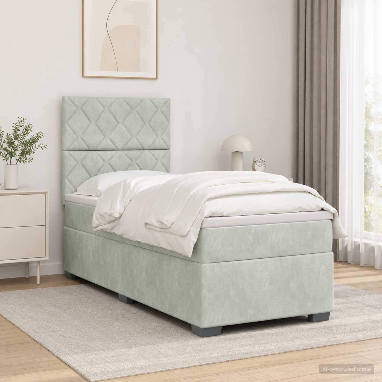 Hellgrünes gepolstertes Einzelbett mit gestepptem Kopfteil und weißer Bettwäsche in einem hellen, minimalistischen Schlafzimmer.