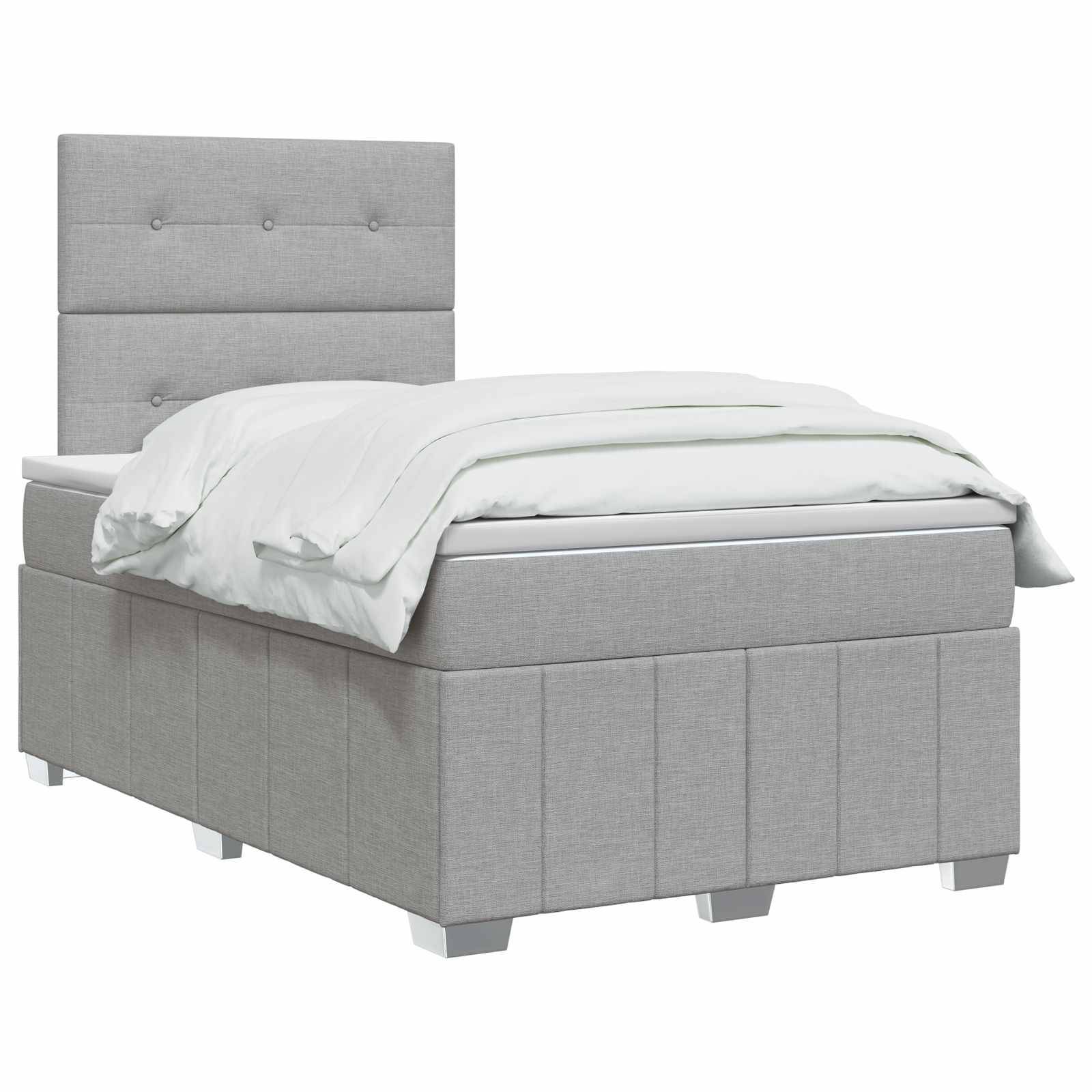 Grau gepolstertes Einzelbett mit gestepptem Kopfteil und weißer Bettwäsche auf neutralem Hintergrund.