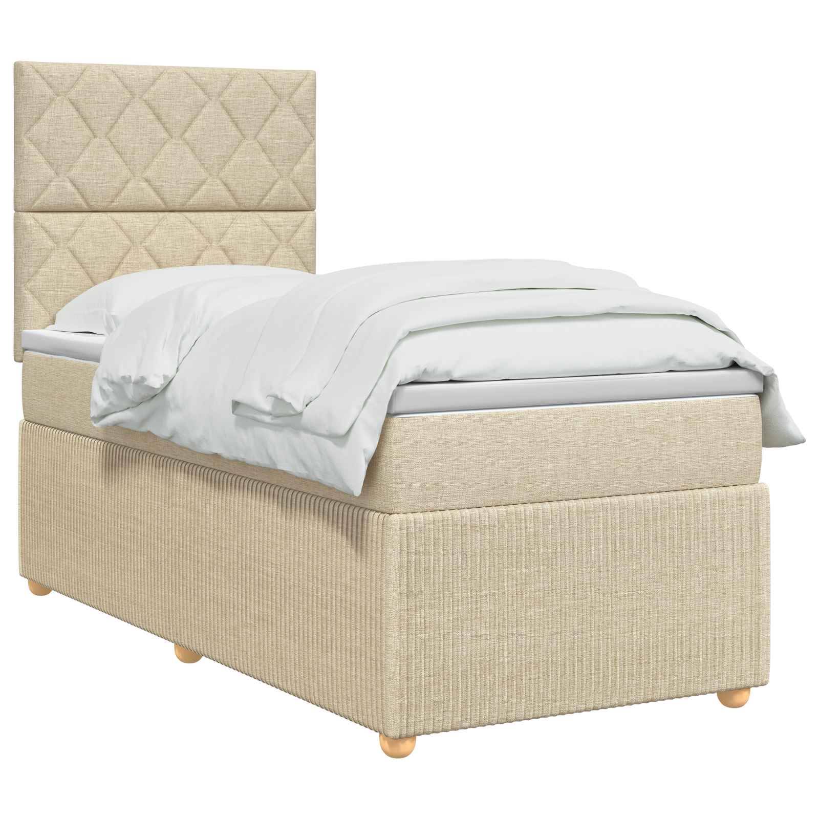 Beige gepolstertes Einzelbett mit gestepptem Kopfteil, Matratze, weißer Bettwäsche und Stauraumbasis auf Holzfüßen, freigestellt auf weißem Hintergrund.
