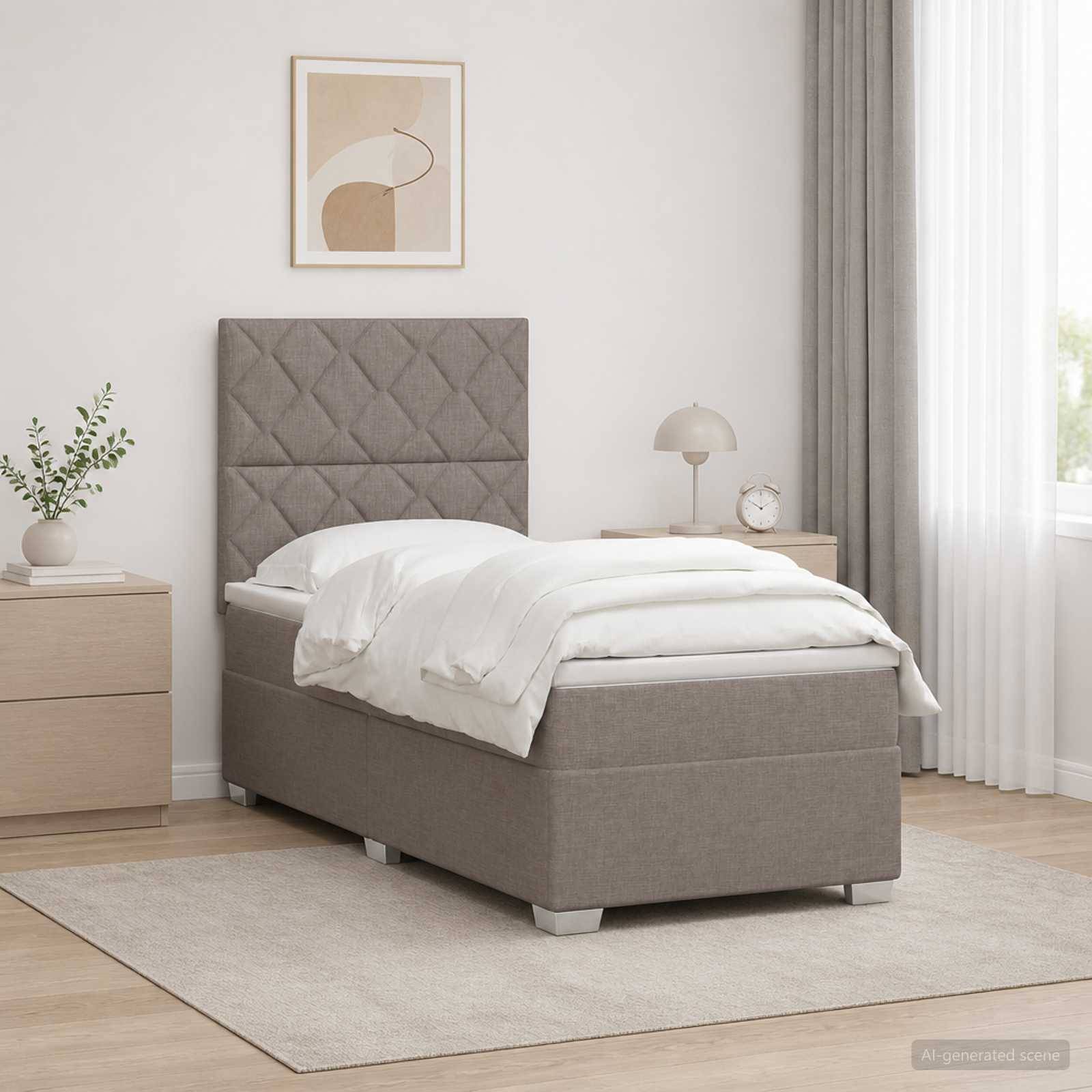 Ein ordentliches modernes Schlafzimmer mit einem grau gepolsterten Einzelbett, weißer Bettwäsche, Nachttischen, Lampe, Pflanze, gerahmter Kunst, Teppich und durchscheinenden Vorhängen.