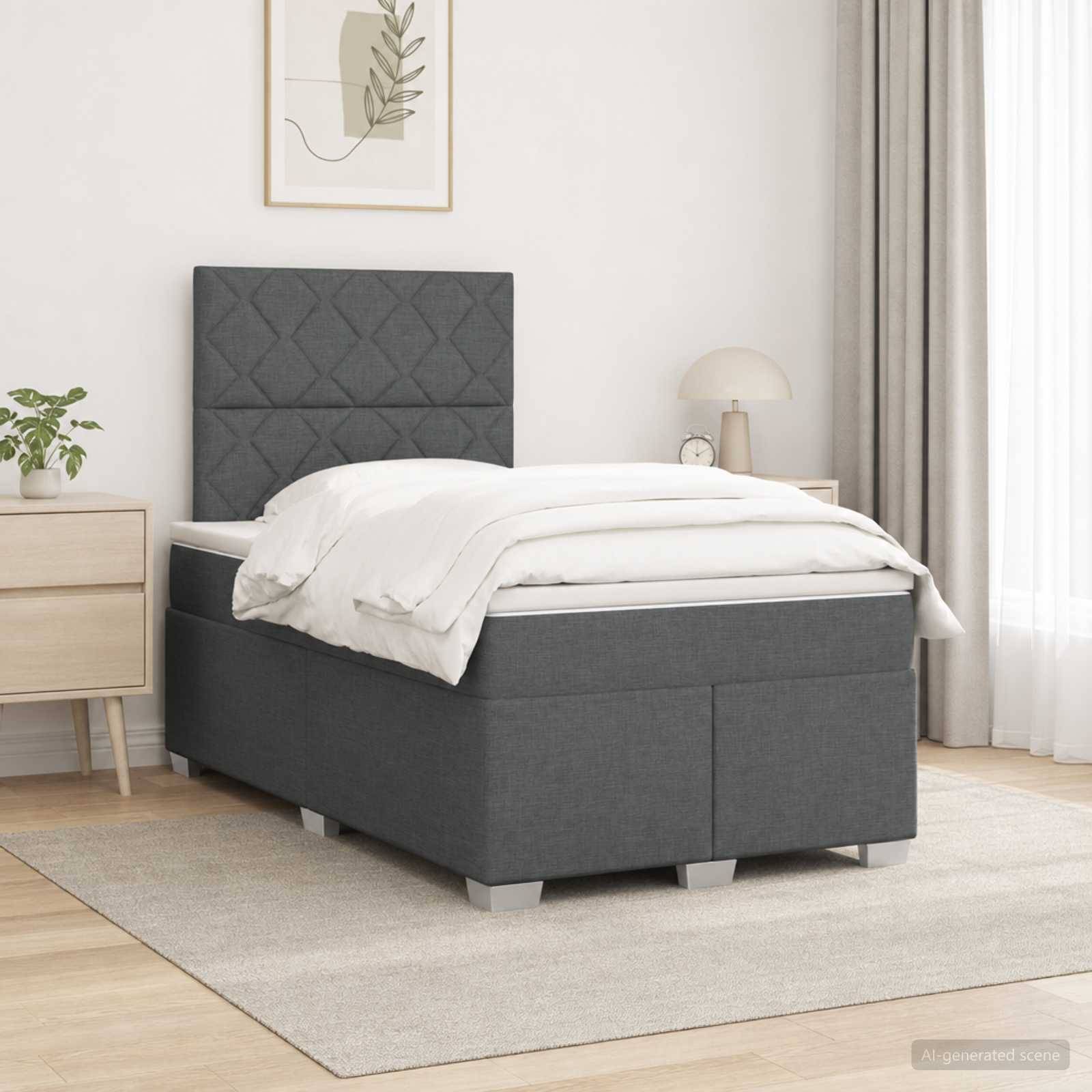 Grau gepolstertes Einzelbett mit gestepptem Kopfteil in einem hellen, minimalistischen Schlafzimmer, gezeigt mit weißer Bettwäsche und Nachttisch.
