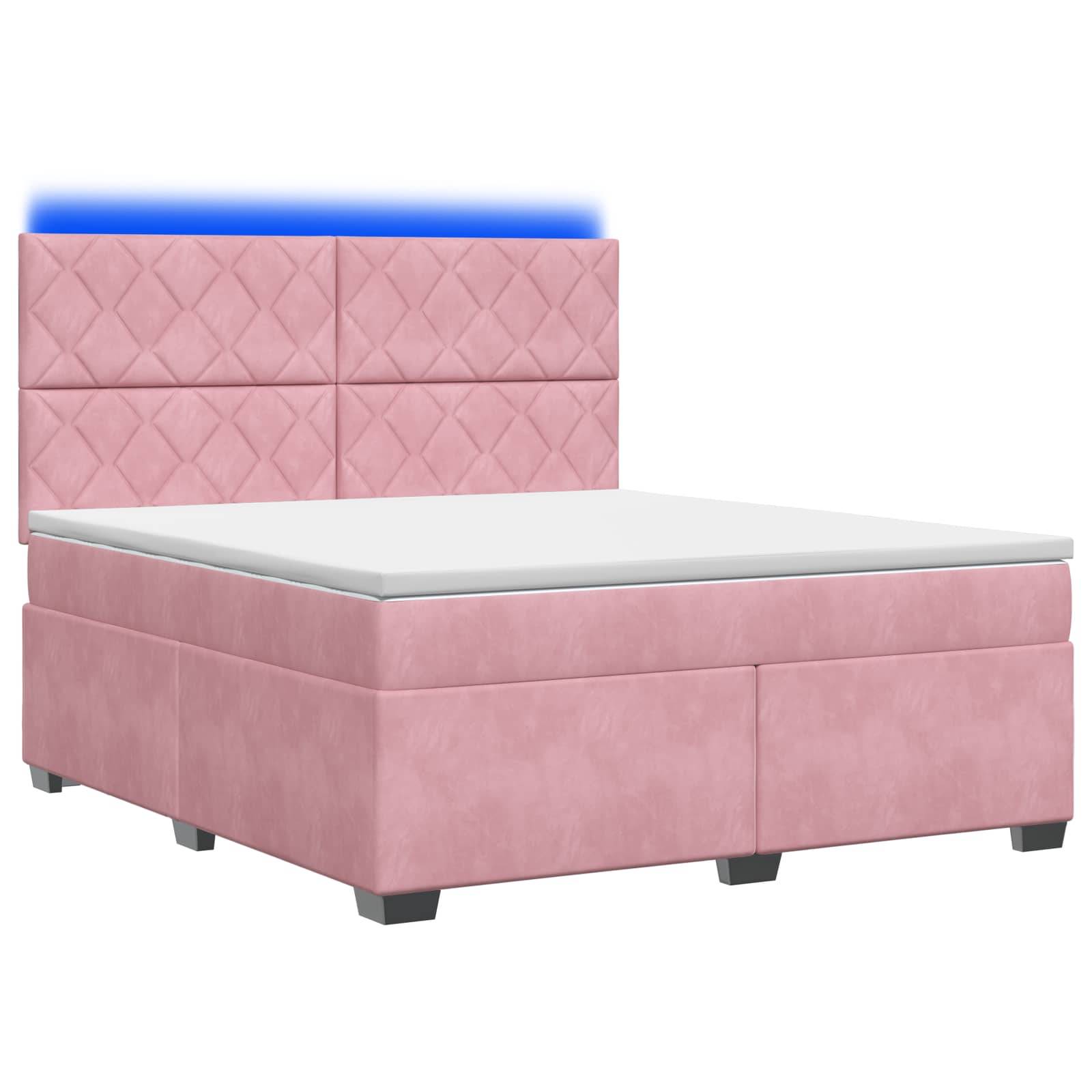 Rosa gepolstertes Bett mit gestepptem Kopfteil und weißer Matratze auf dunklen Beinen, dargestellt vor einem einfachen weißen Hintergrund.