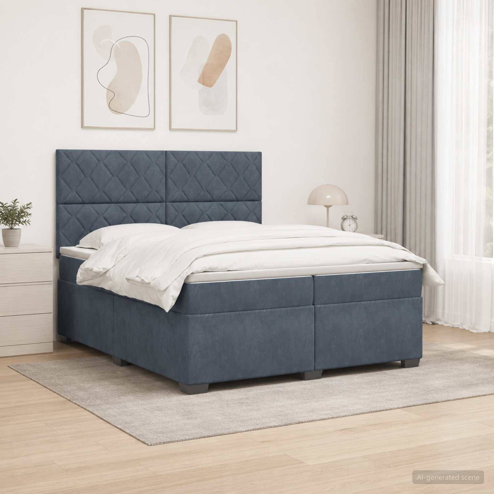 Blaues Polsterbett mit gestepptem Kopfteil, weiße Bettwäsche und passende Speicherbasis in einem hellen, minimalistischen Schlafzimmer.