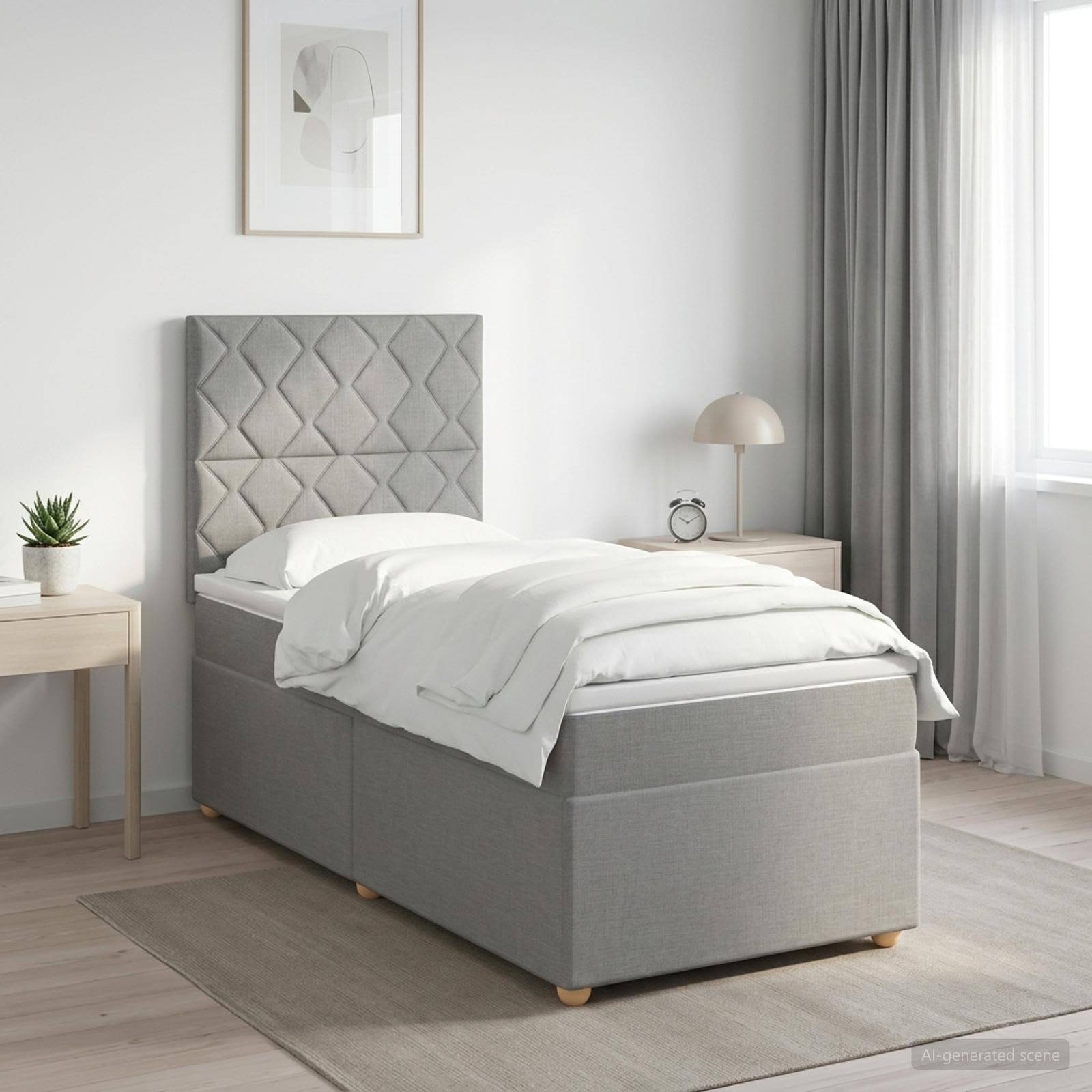 Minimales grau gepolstertes Einzelbett mit gestepptem Kopfteil, weiße Bettwäsche und passende Nachttische in einem hellen, modernen Schlafzimmer.