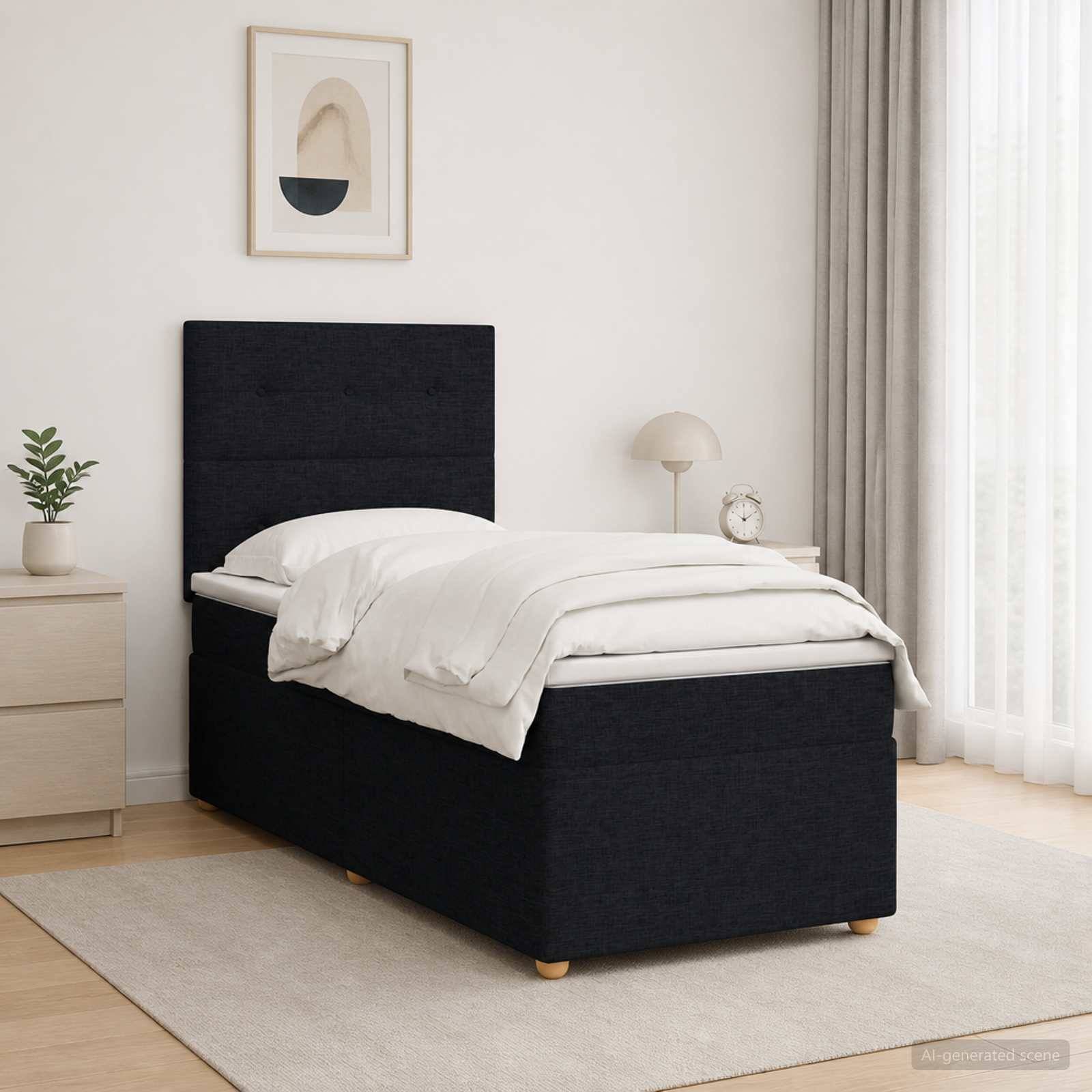 Modernes Schlafzimmer mit einem schwarz gepolsterten Einzelbett, weißer Bettwäsche, Nachttisch, Lampe, Pflanze, gerahmtem Wandbild und transparenten Vorhängen.