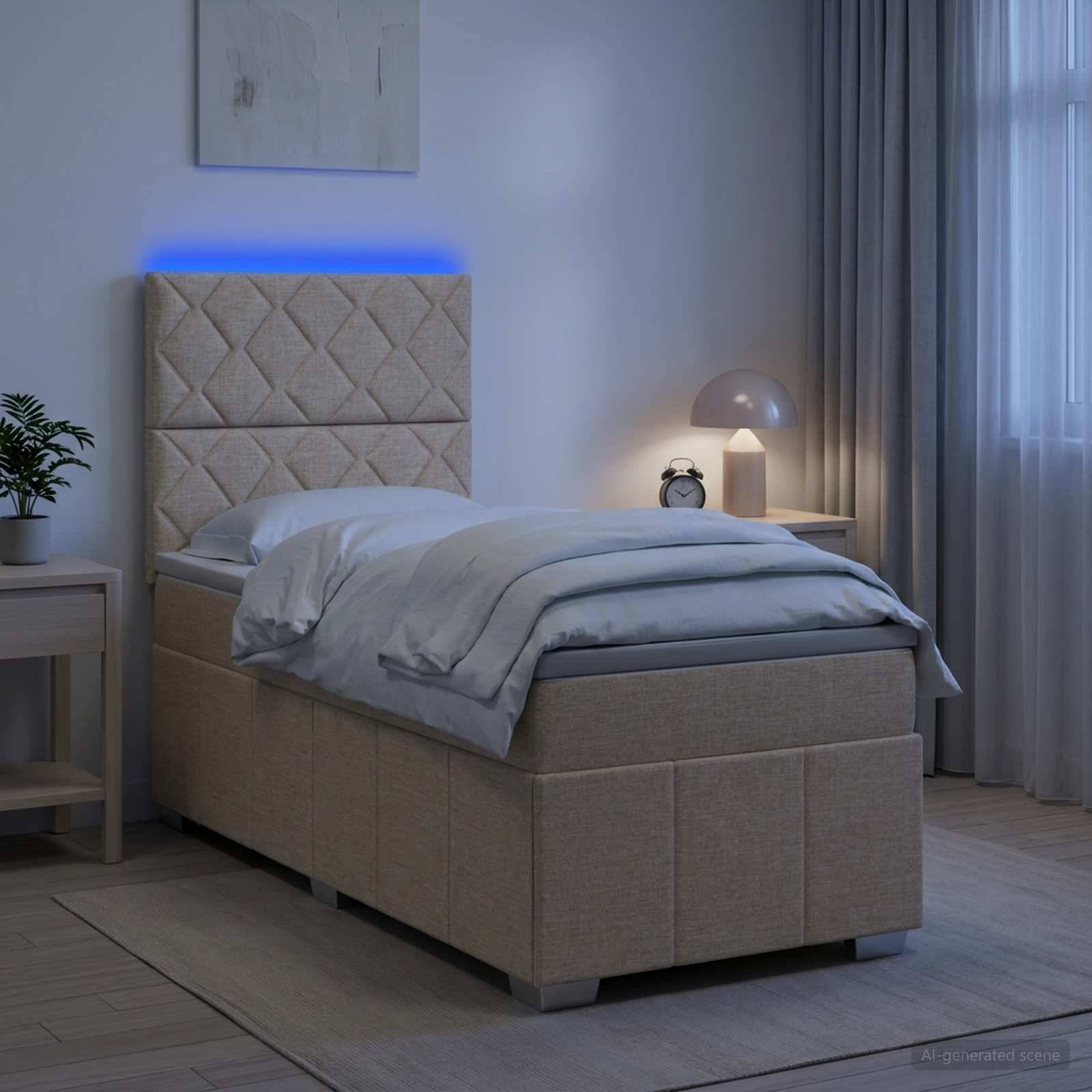 Modernes beige gepolstertes Bett mit grauer Bettwäsche und blau beleuchteten Kopfende in einem sanft beleuchteten Schlafzimmer, neben einem Nachttisch, einer Lampe und einer Uhr.