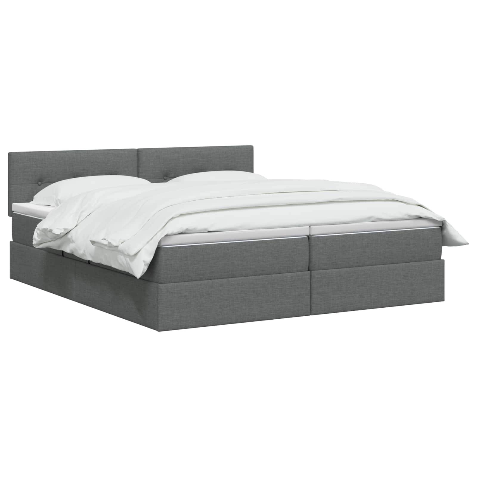 Grau gepolstertes Bett mit weißer Bettwäsche auf einfachem weißem Hintergrund.