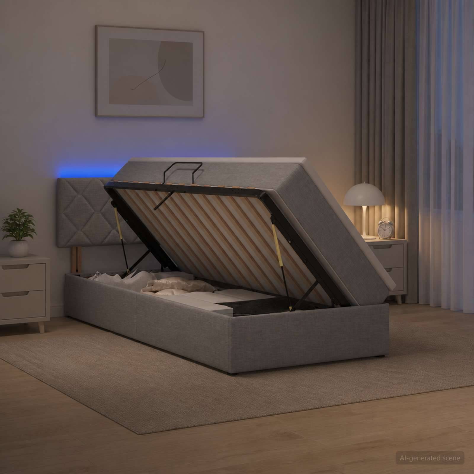 Grau gepolstertes Stahlbett mit angehobenem Lattenrost und Unterbettspeicher in einem modernen Schlafzimmer.