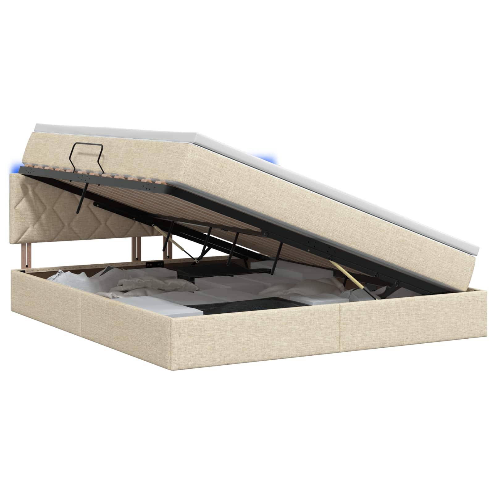 Beige gepolstertes Speicherbettgestell mit geöffnetem Matratzenheber, das den inneren Stauraum und den Metallstützrahmen zeigt.