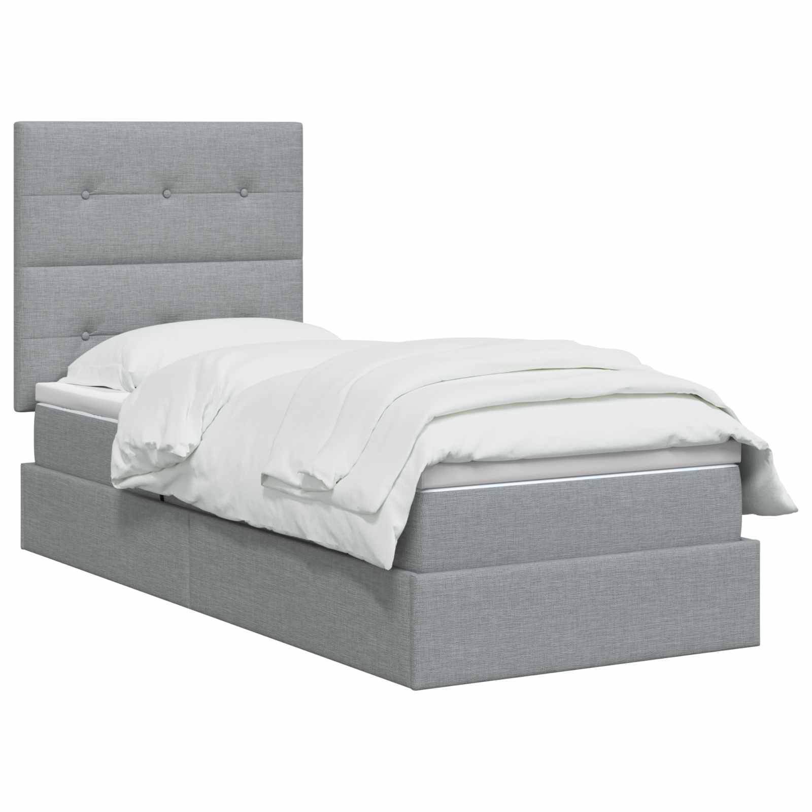 Grau gepolstertes Bett mit kapitoniertem Kopfteil und weißer Bettwäsche auf weißem Hintergrund.