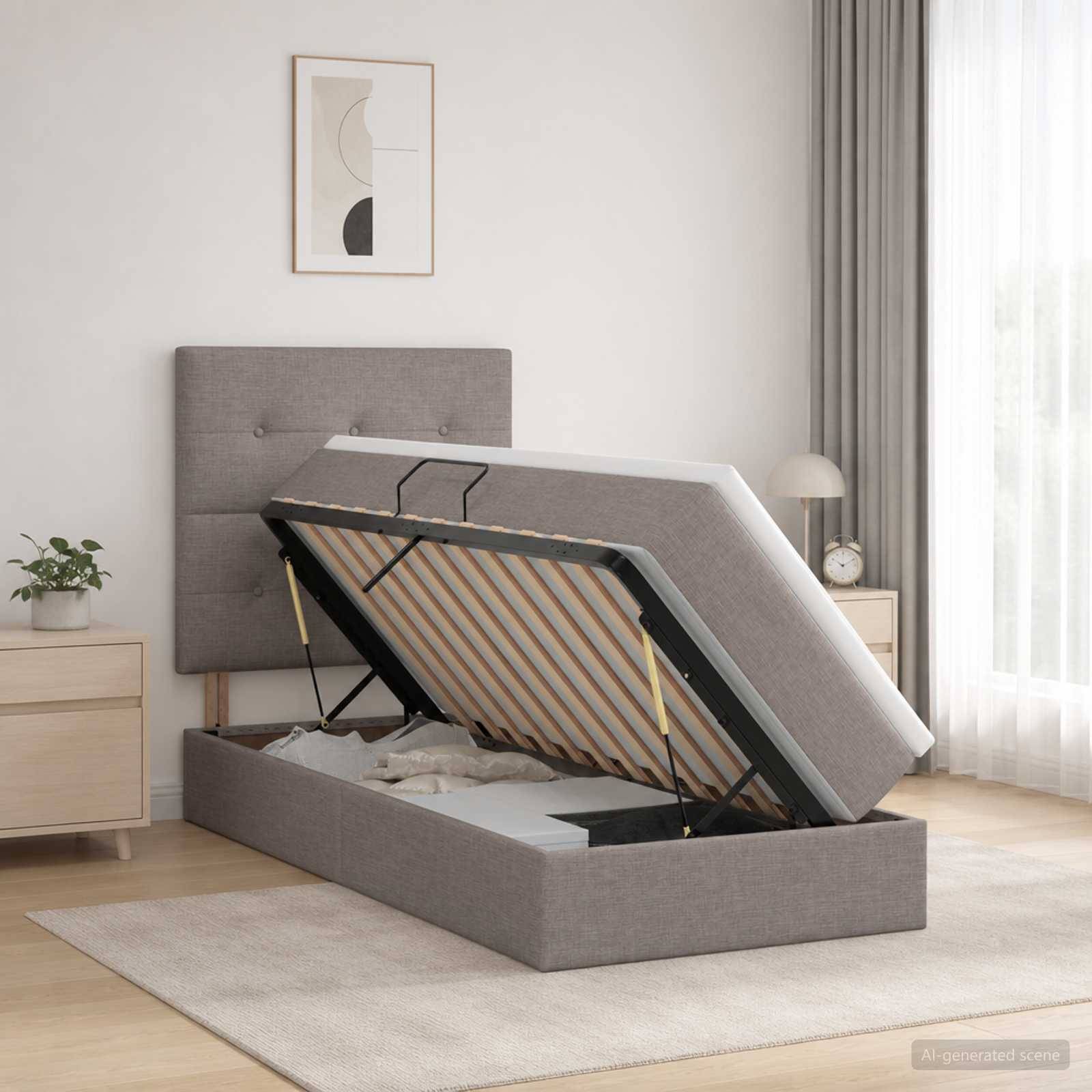 Grau gepolstertes Ottomane-Bett mit aufgeklappter Matratze, die Stauraum in einem hellen modernen Schlafzimmer zeigt.