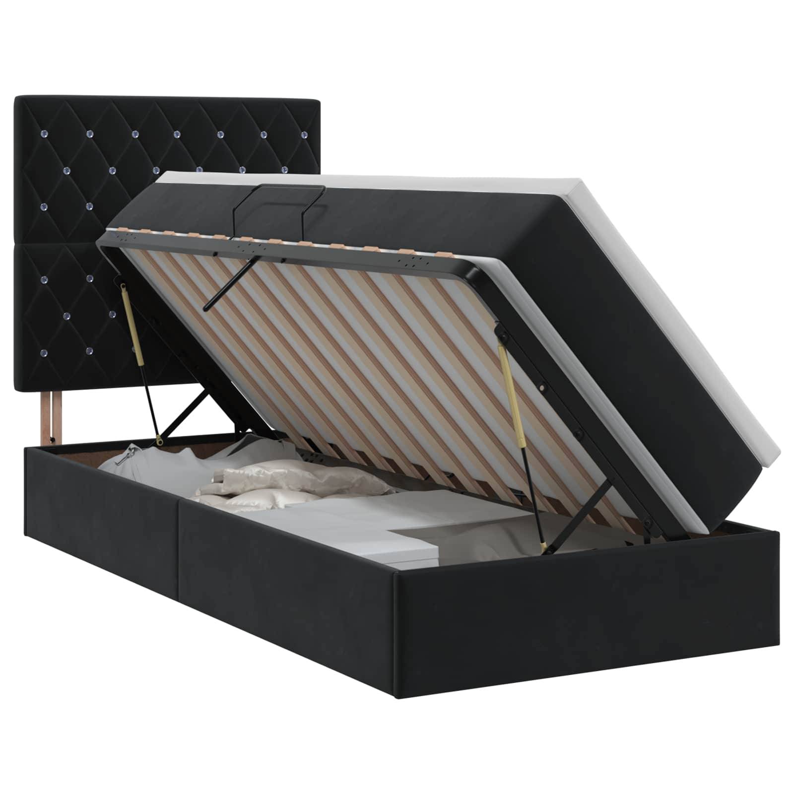 Schwarzes gepolstertes Bett mit Stauraum und gestepptem Kopfteil, offen dargestellt, um die Matratzenunterlage und das Stauraum-Staufach unter dem Bett zu zeigen.