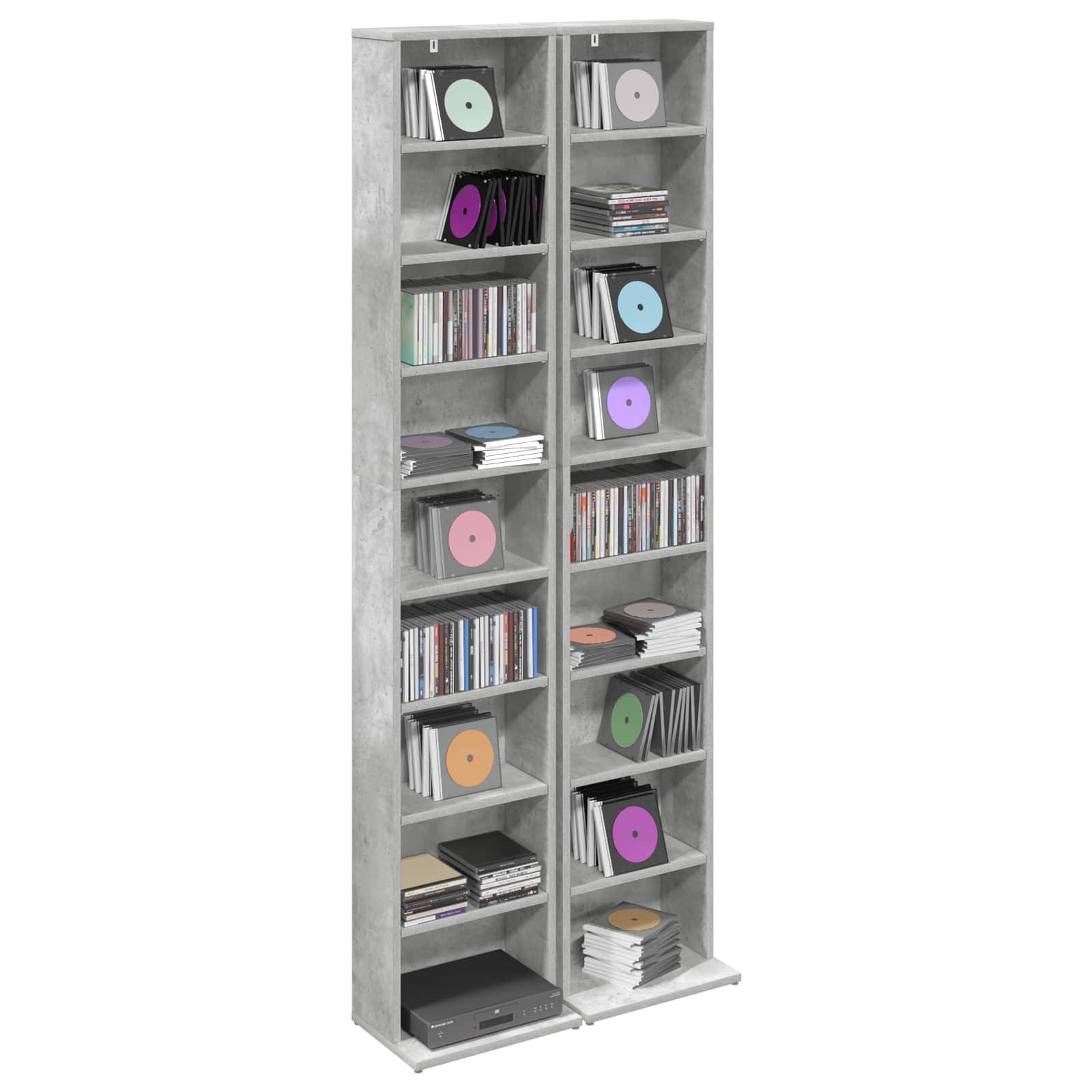 Hohes graues Regaleinheit gefüllt mit CDs, DVDs und Büchern, das mehrere Fächer zur Medienspeicherung zeigt.